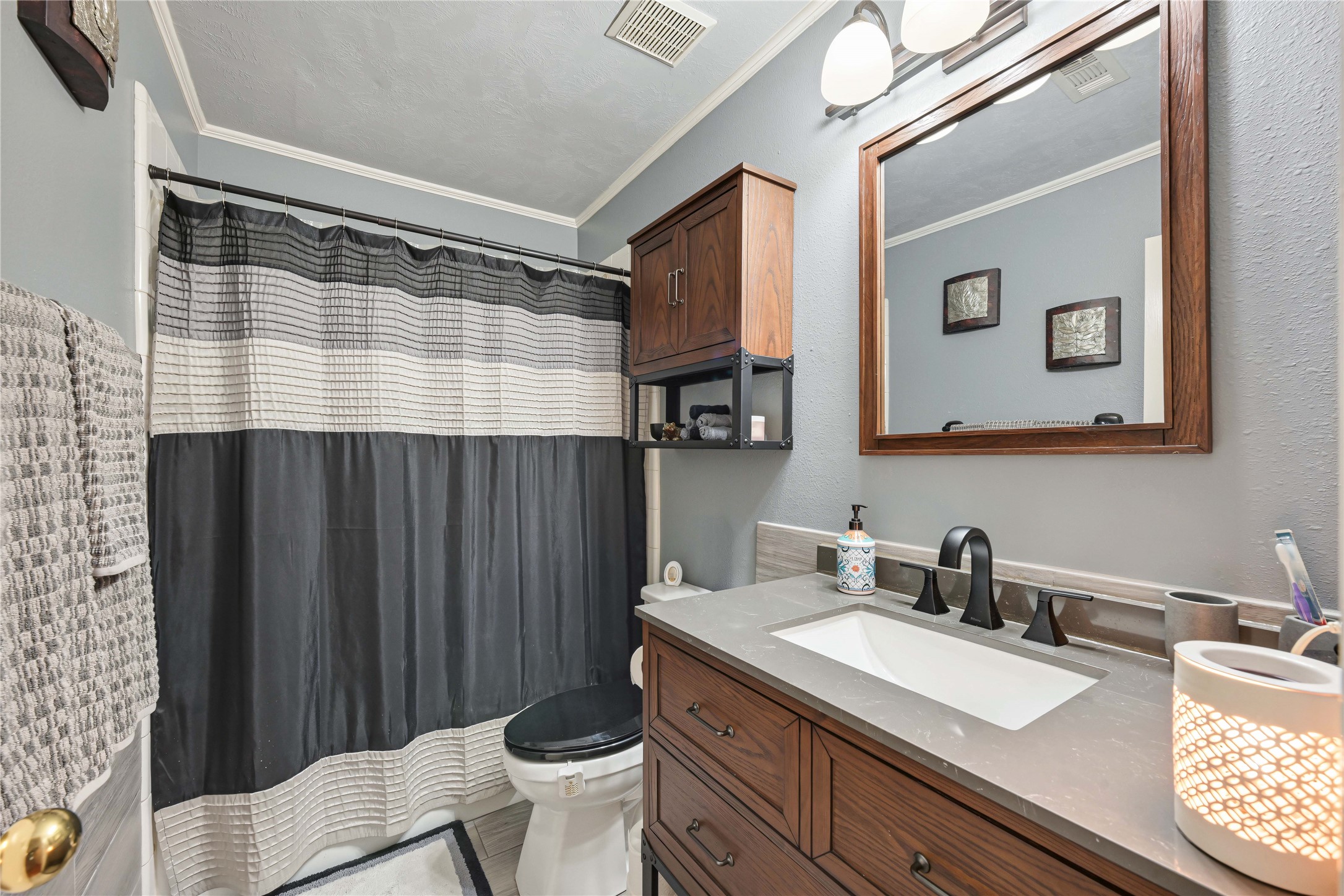 Guest bathroom with tiled wall