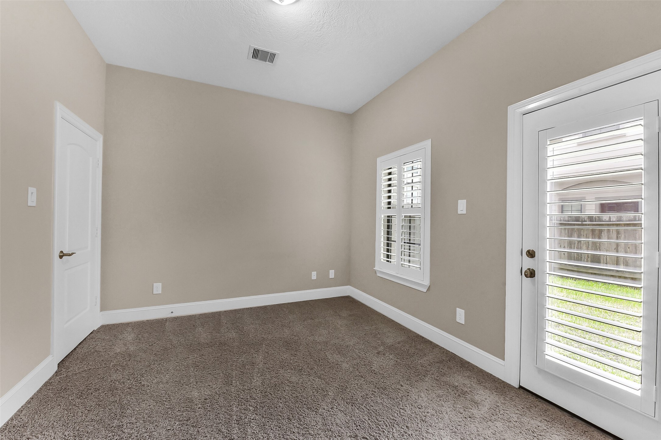 The first level has a bedroom with en-suite bath.  Home has been upgraded with shutters on the windows.