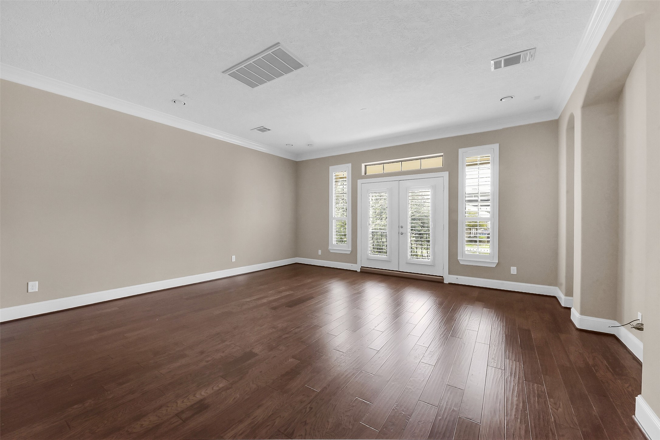 The second floor living with hardwood flooring, crown molding and plenty of natural light.