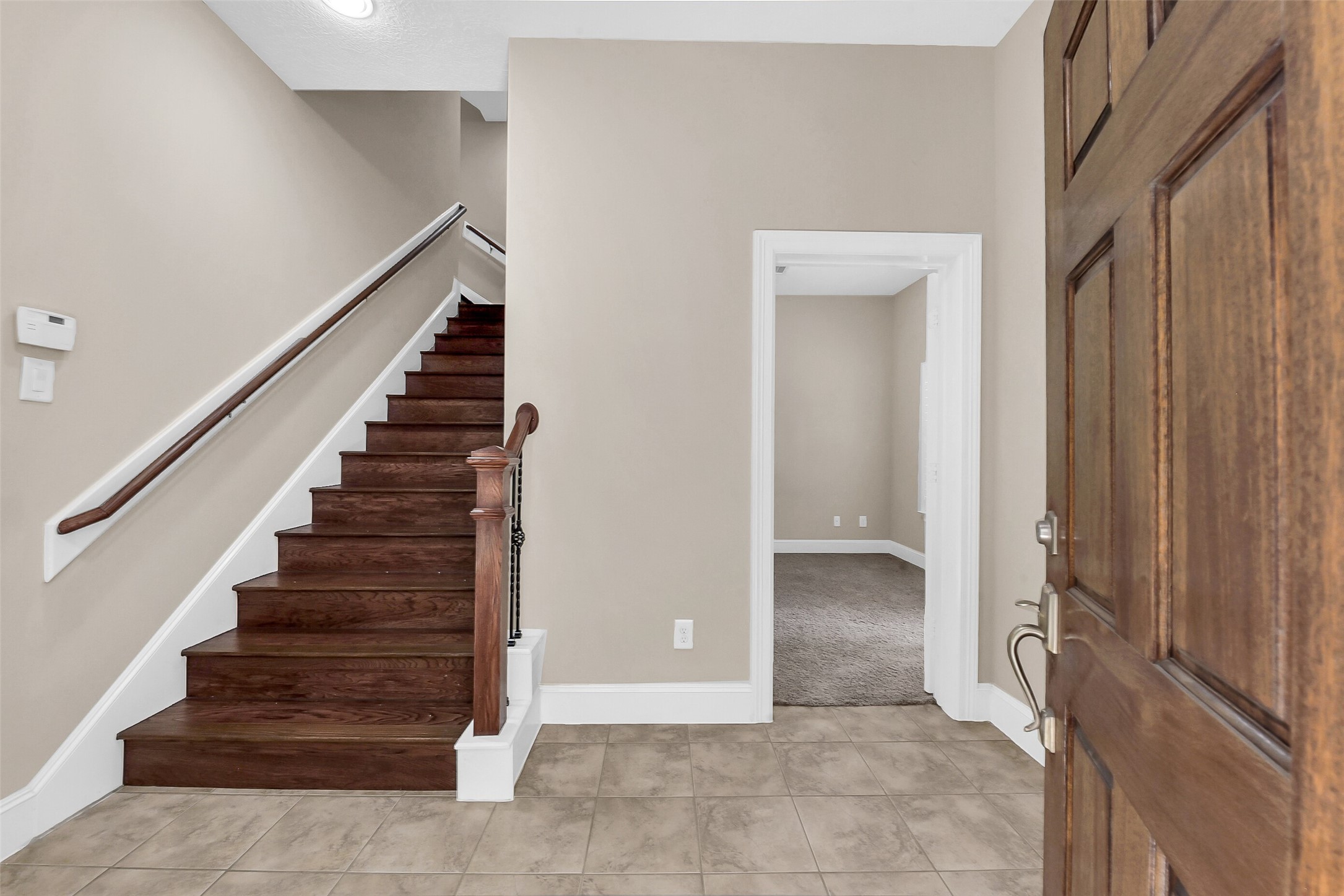 Follow the wood lined stairs to the second level where the family room, kitchen and dining area is located.