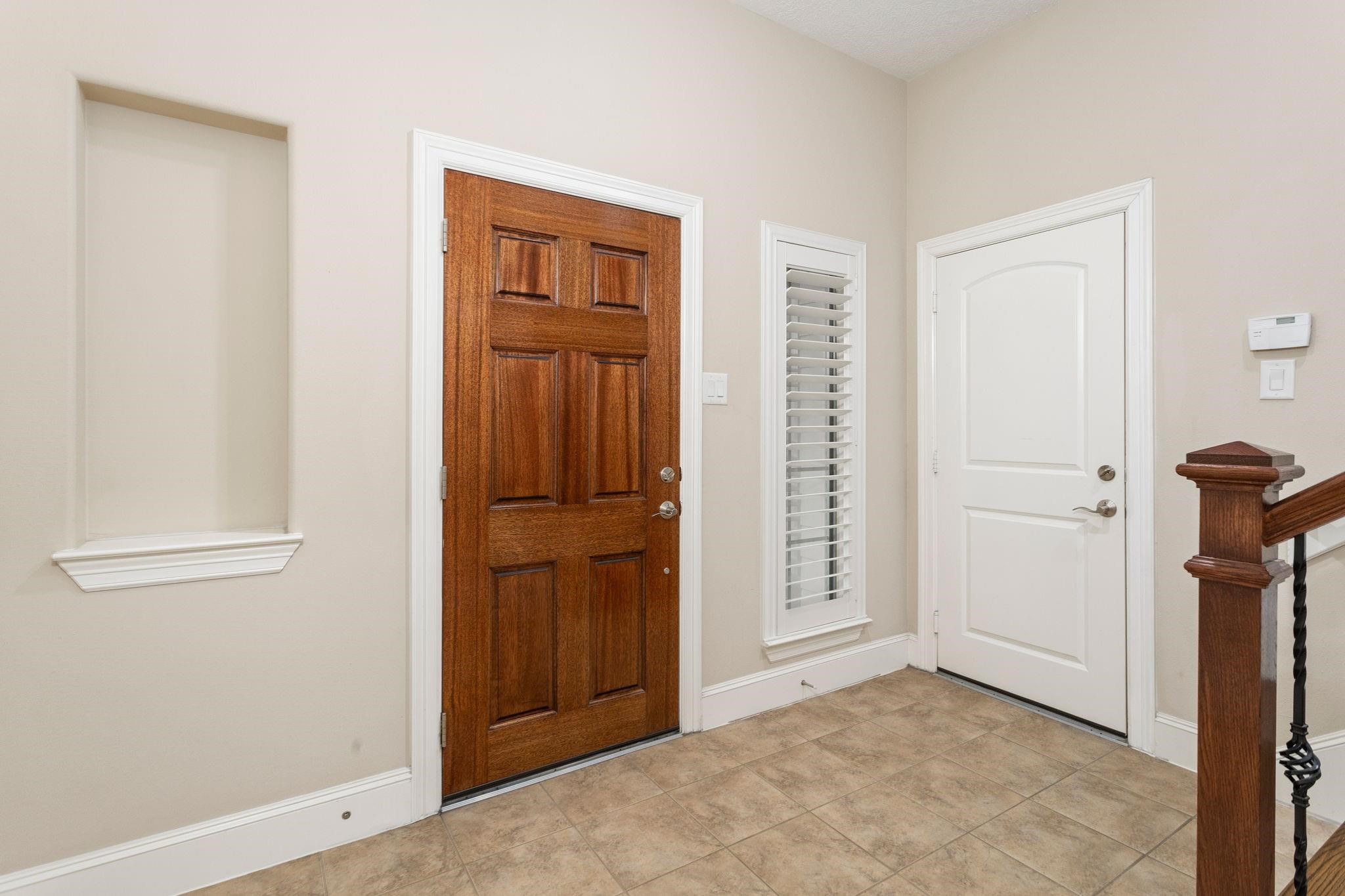 Enter the tile covered entry area of your new home.