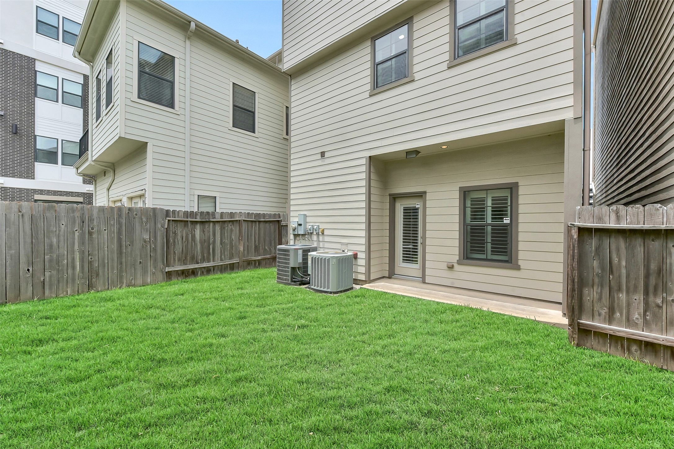 This home has a covered patio and its own fenced in private backyard.