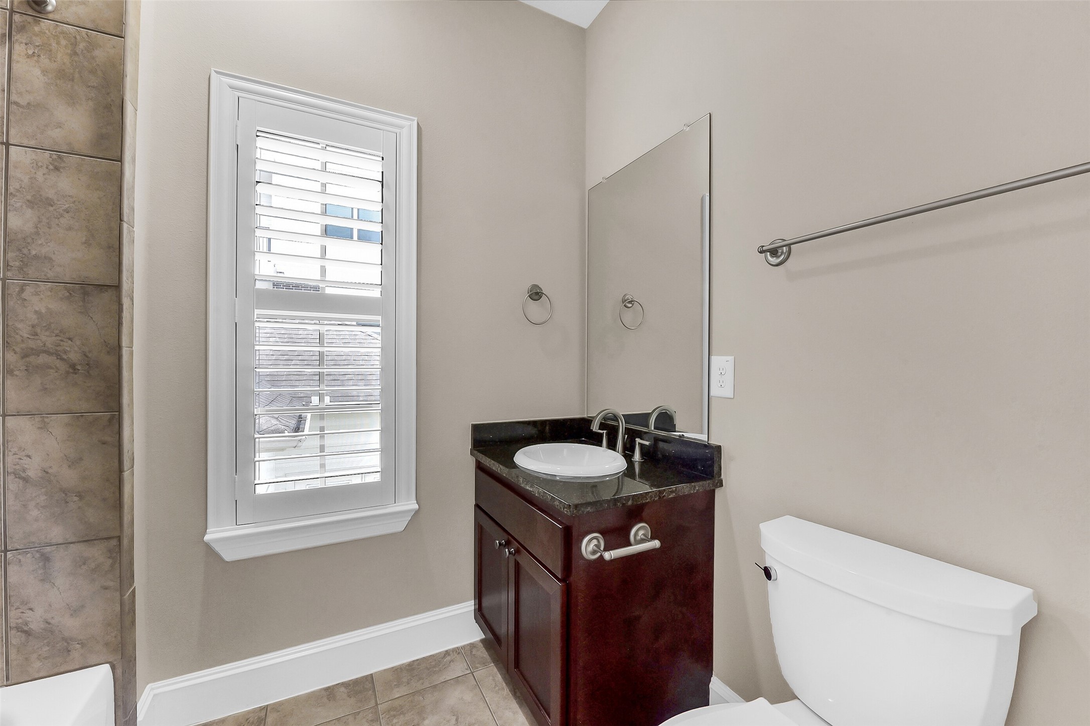 Secondary bedroom has private bath with tub shower combination.