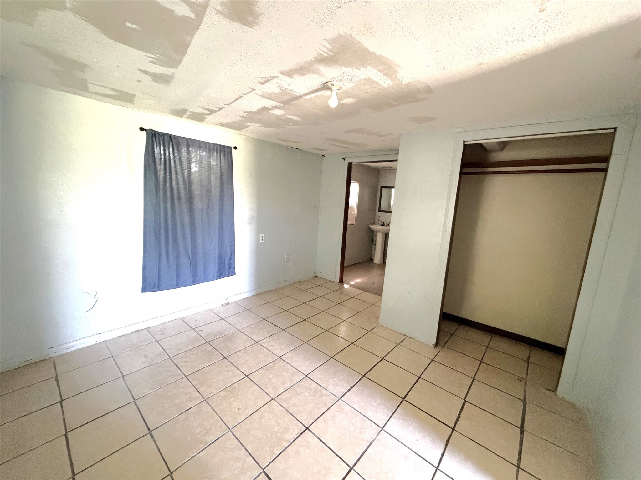 Another view of the bedroom of the second house that leads to the bath.