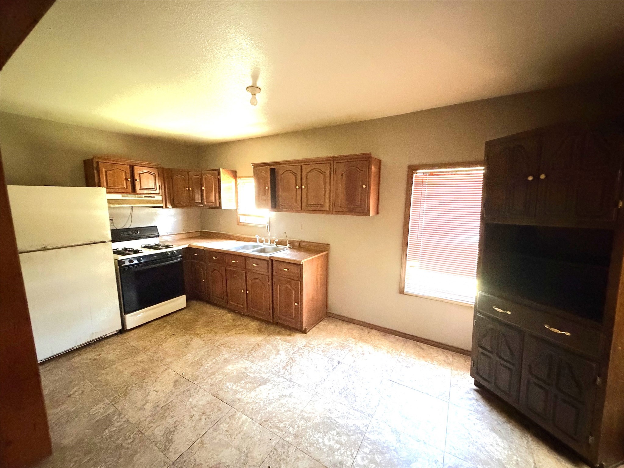 The kitchen has room for a table and chairs.