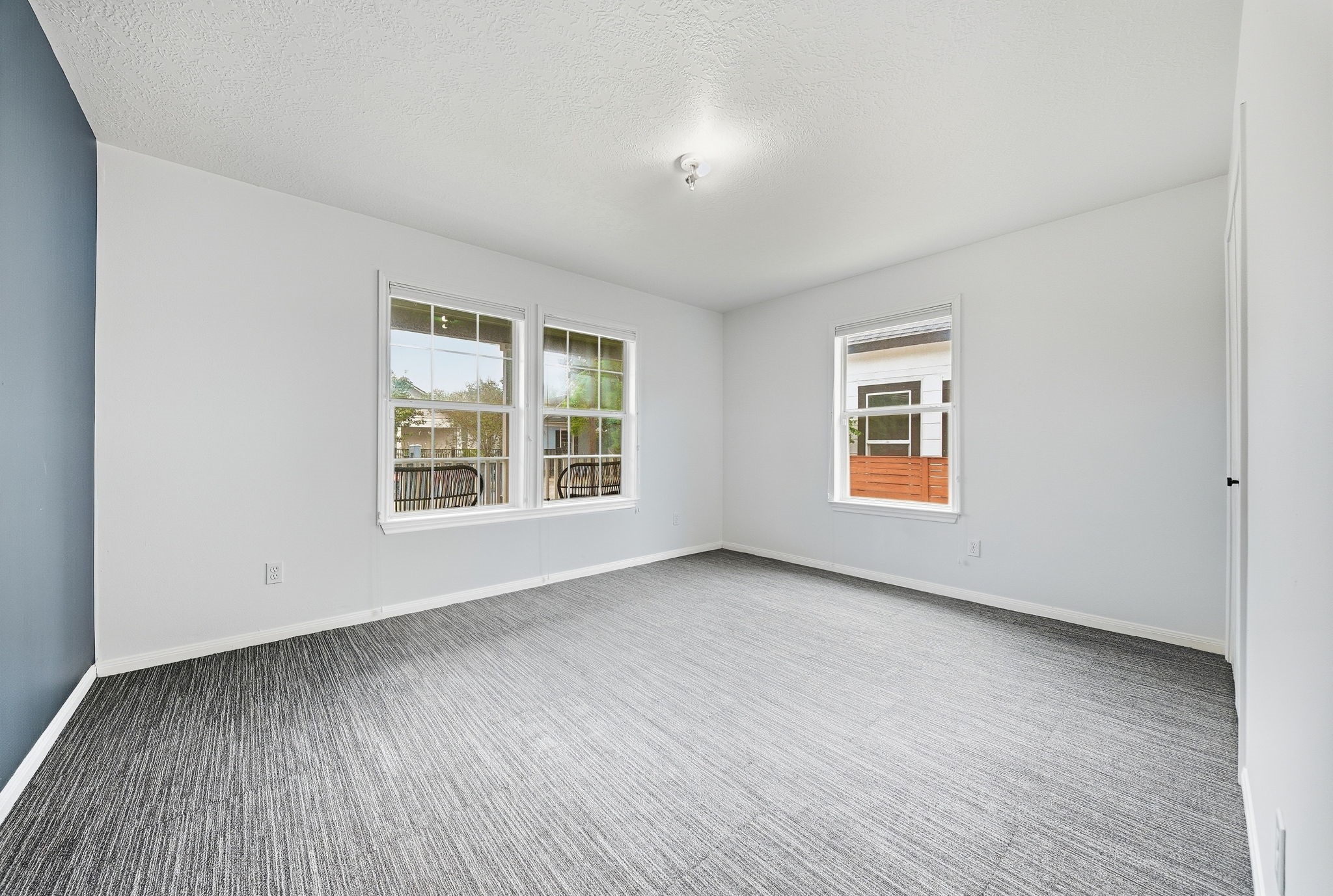 Secondary spacious bedroom located at the front of the home.
