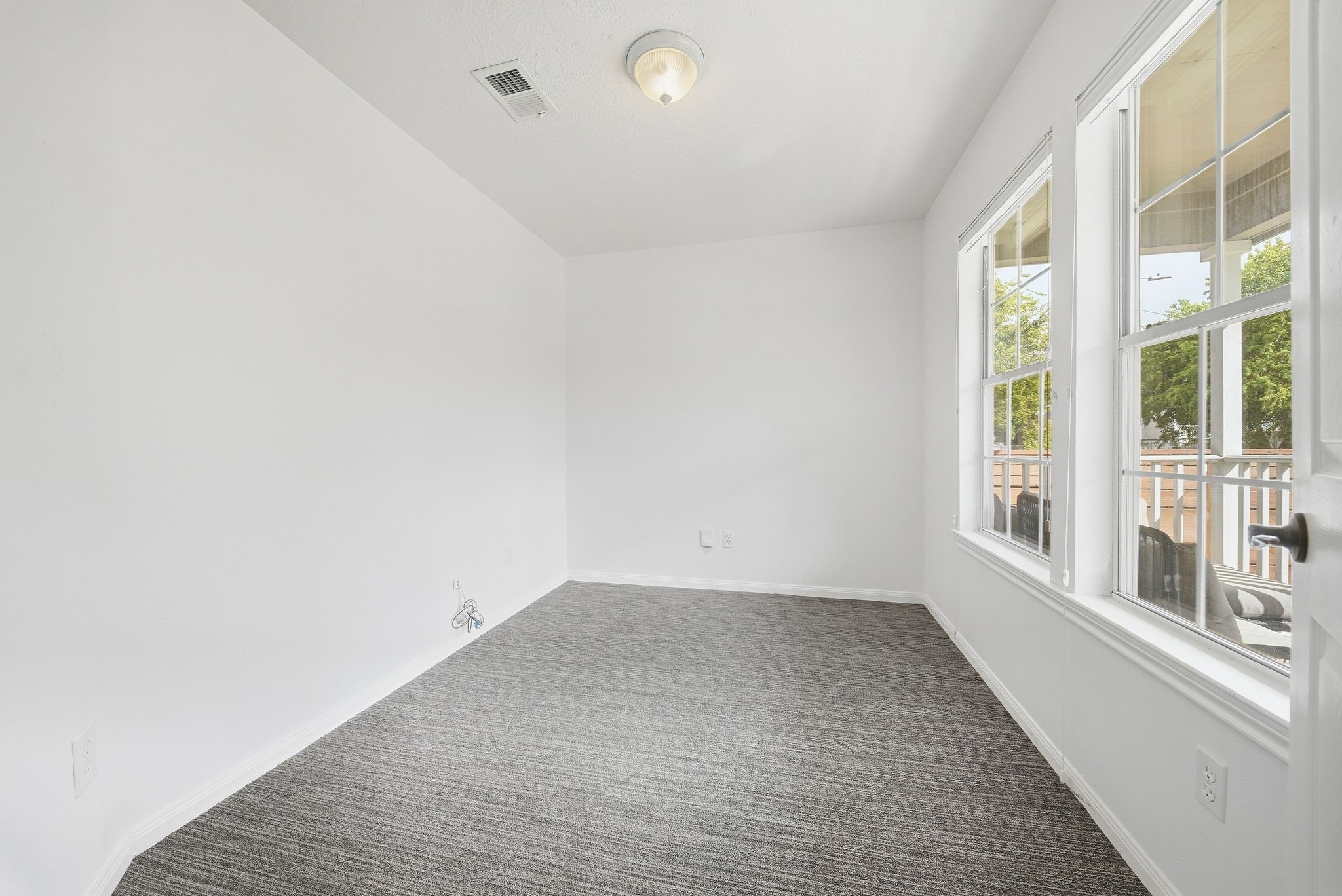Flexible home office space with direct view to the front porch.