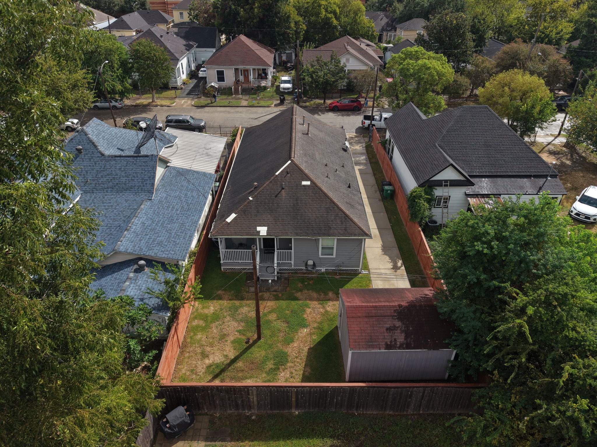 Aerial view of the home's rear exterior and backyard.