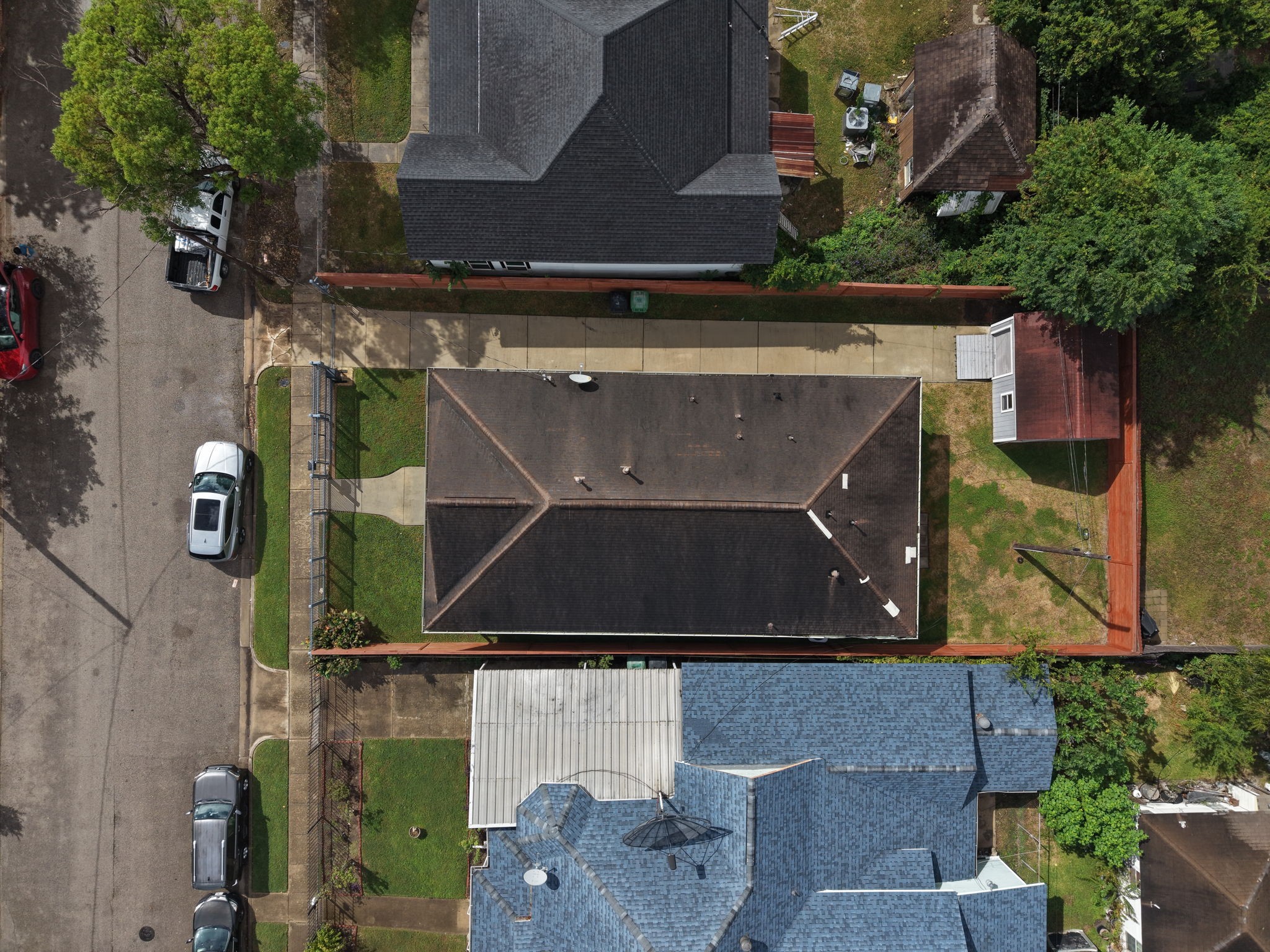 Aerial view of the property highlighting the spacious backyard and the detached workshop/shed.