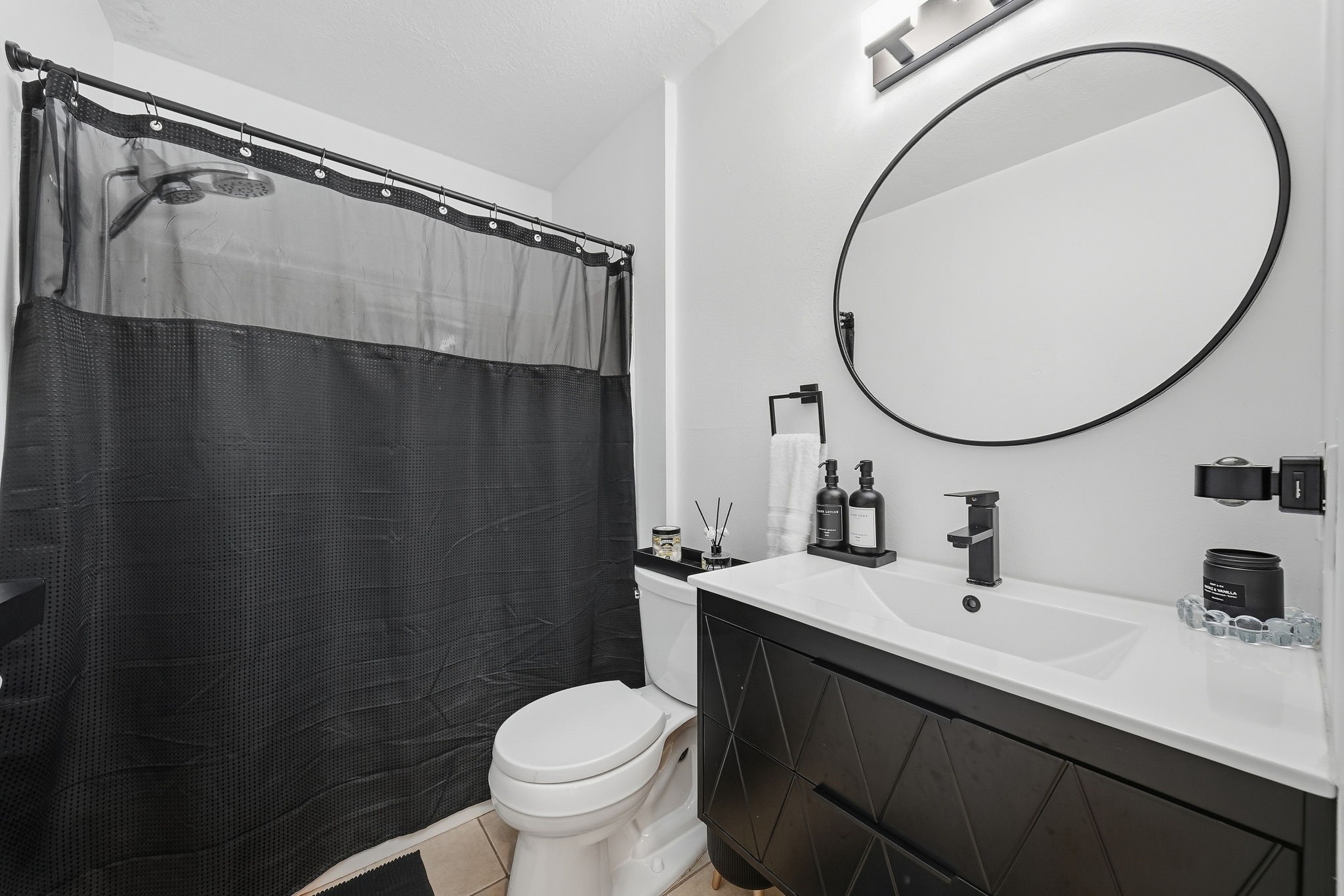 Full bathroom located in the hallway for guest use.
