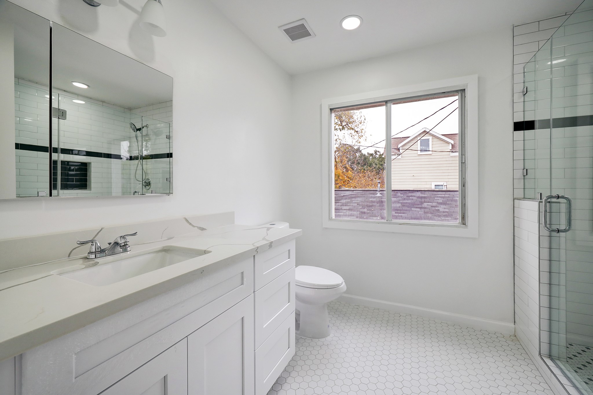 Updated secondary bath with walk-in shower