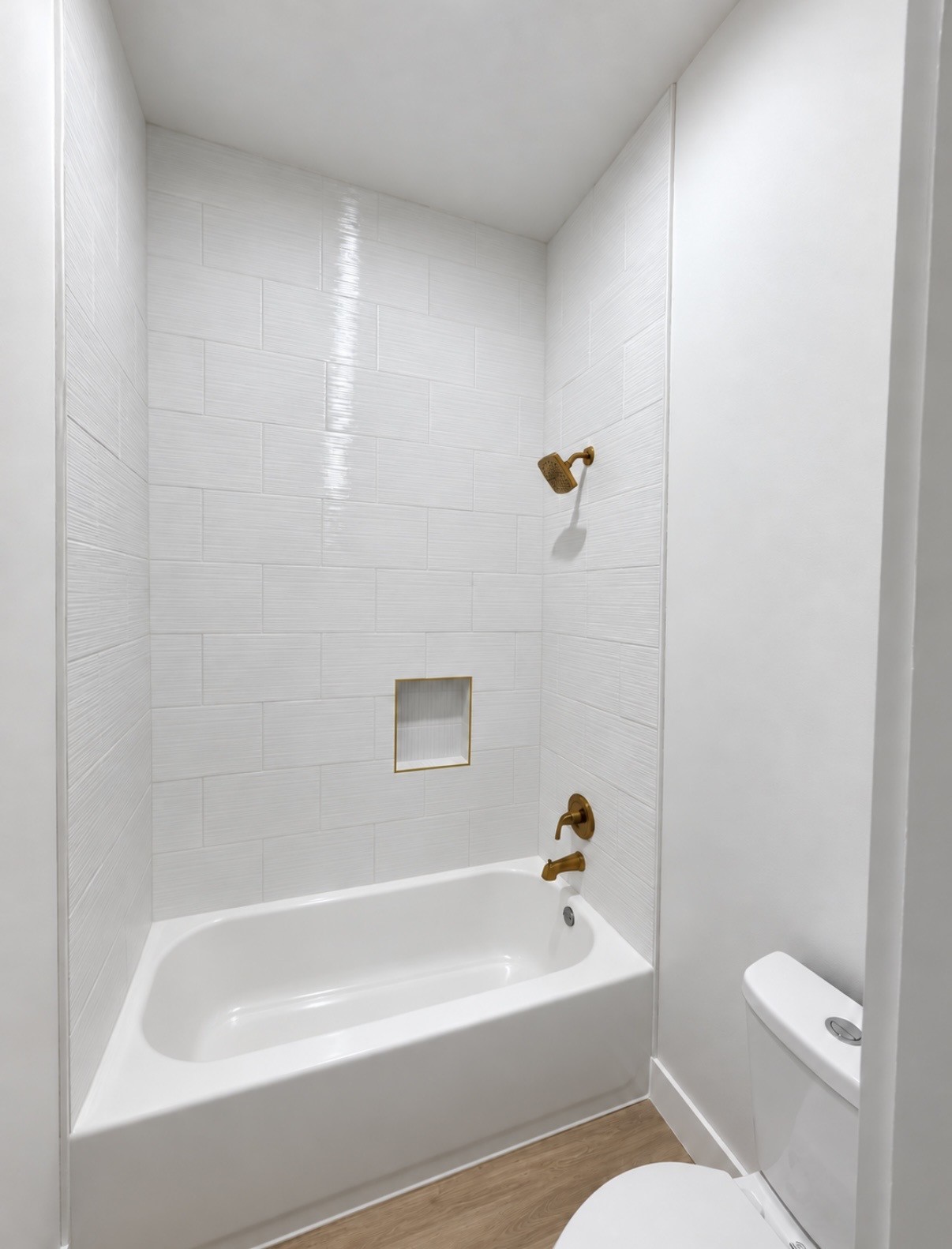 Private secondary bath featuring a tub and shower combination, dual vanity and LED mirror.