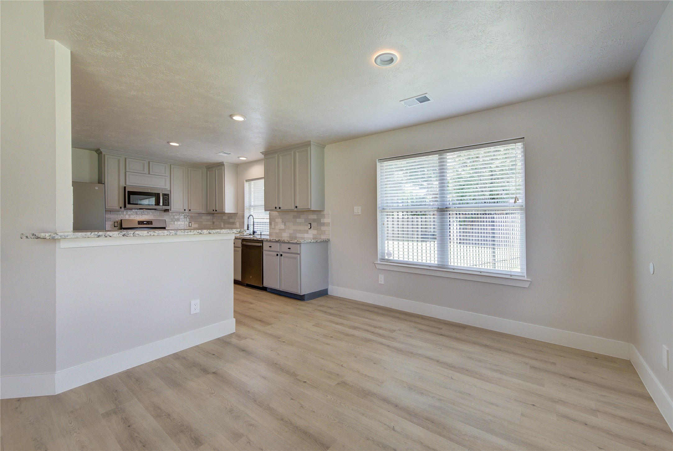 From the moment you enter, you'll appreciate the clean modern finishes, updated flooring and functional layout that make this move-in-ready home truly stand out