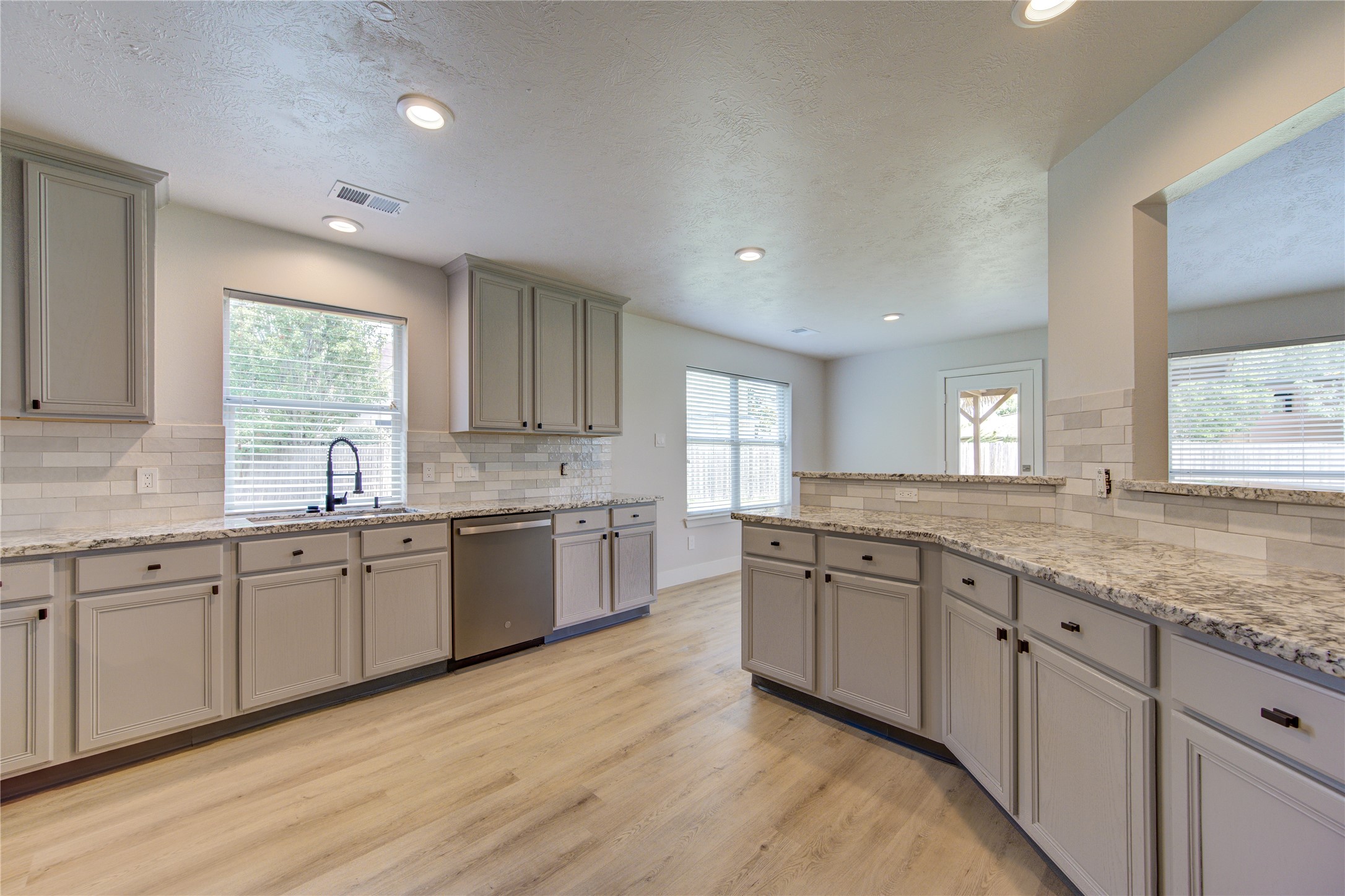 Perfectly positioned adjacent to the kitchen, this casual dining space provides an ideal setting for morning coffee, family meals or homework after school