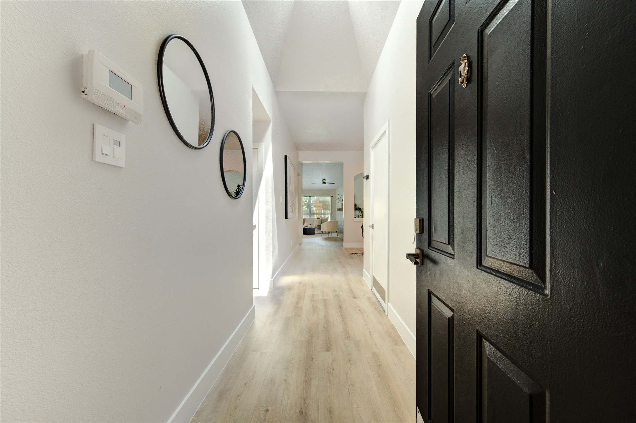the homes bright and welcoming entry, offering an inviting first impression and a clear sightline into the main living space the homes bright and welcoming entry, offering an inviting first impression and a clear sightline into the main living space