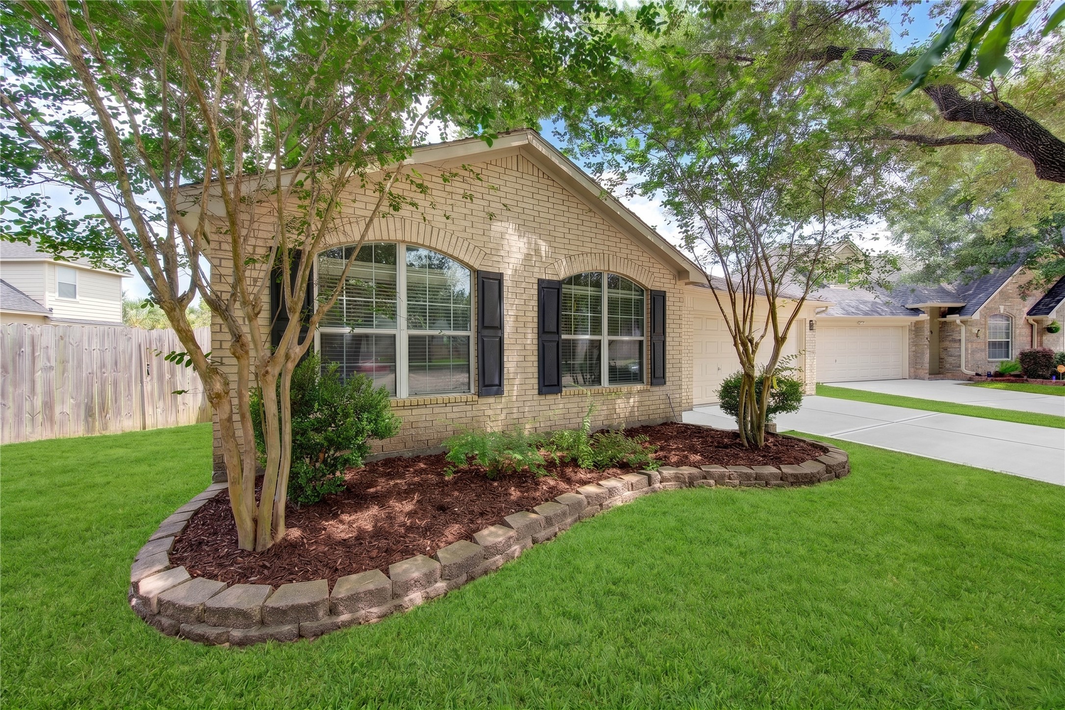 Beautiful curb appeal welcomes you home with mature landscaping, classic brick exterior and a spacious two-car garage, all situated on an oversized cul-de-sac lot in the desirable Waterside Village community