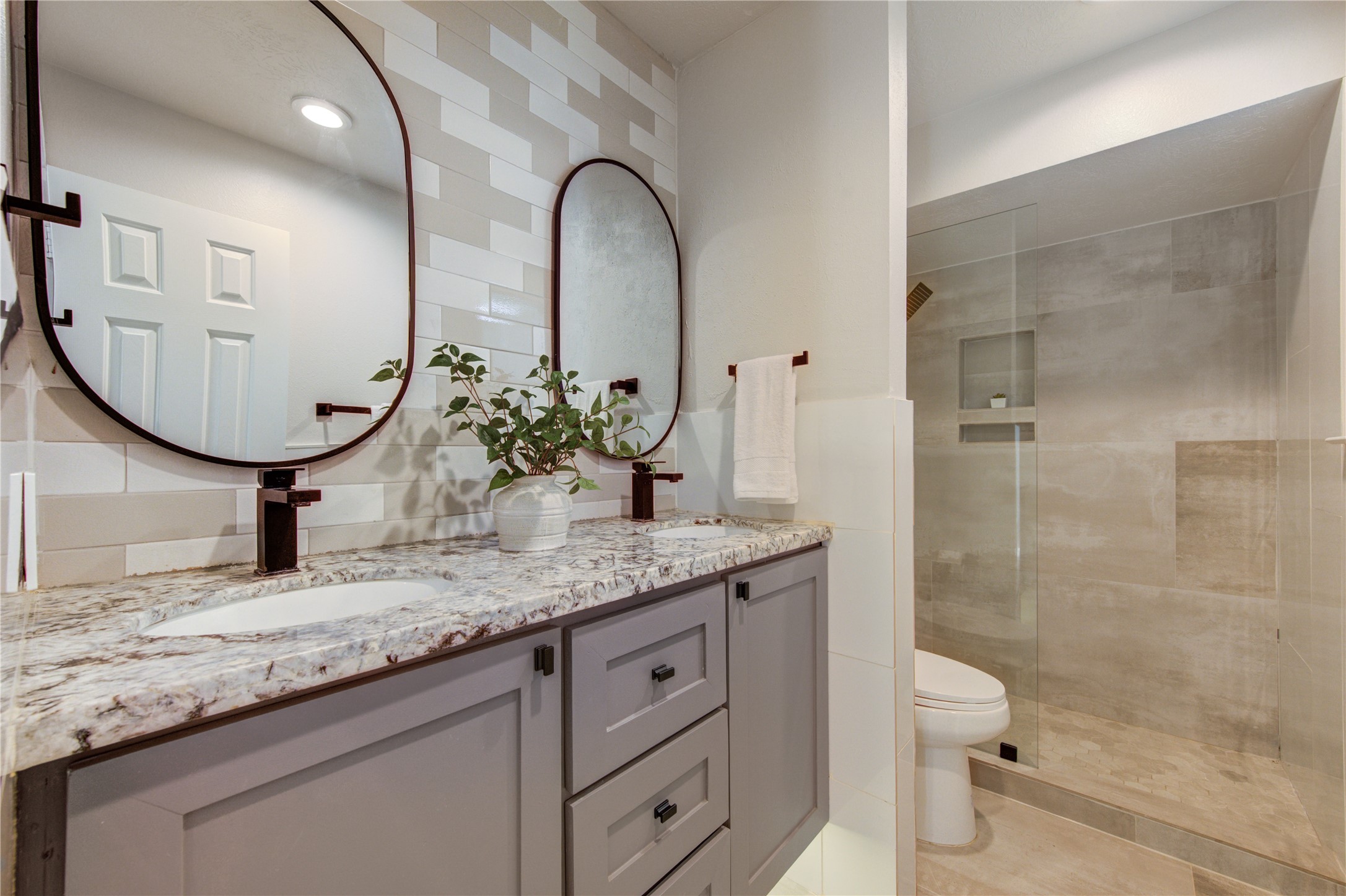 Bathroom 2- floating cabinet features under-cabinet LED lighting