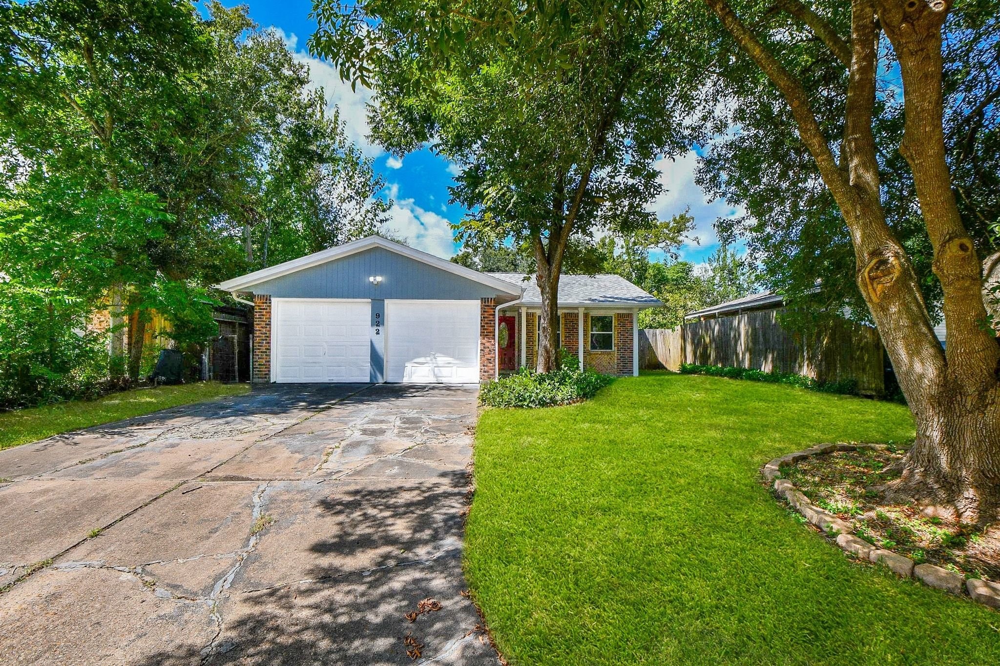 Double wide driveway and a two-car garage anchors this home as a standout property.  The option of only having to raise one door gives you access without sacrificing privacy.  The garage has built in shelving for lots of storage space.