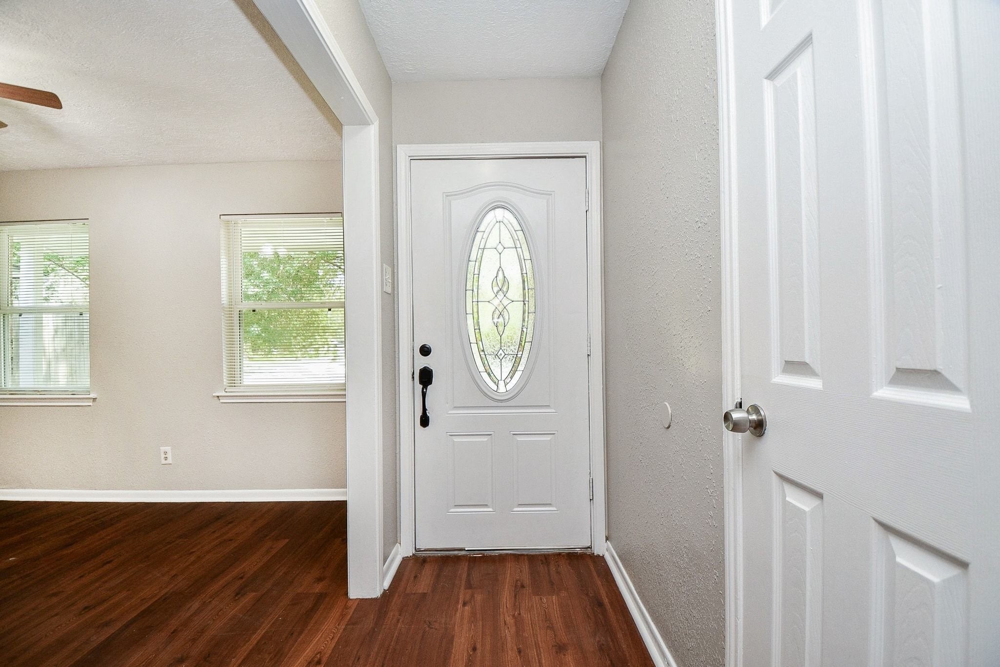 Beautiful, beveled glass inlayed to the front door for added security and privacy protection.