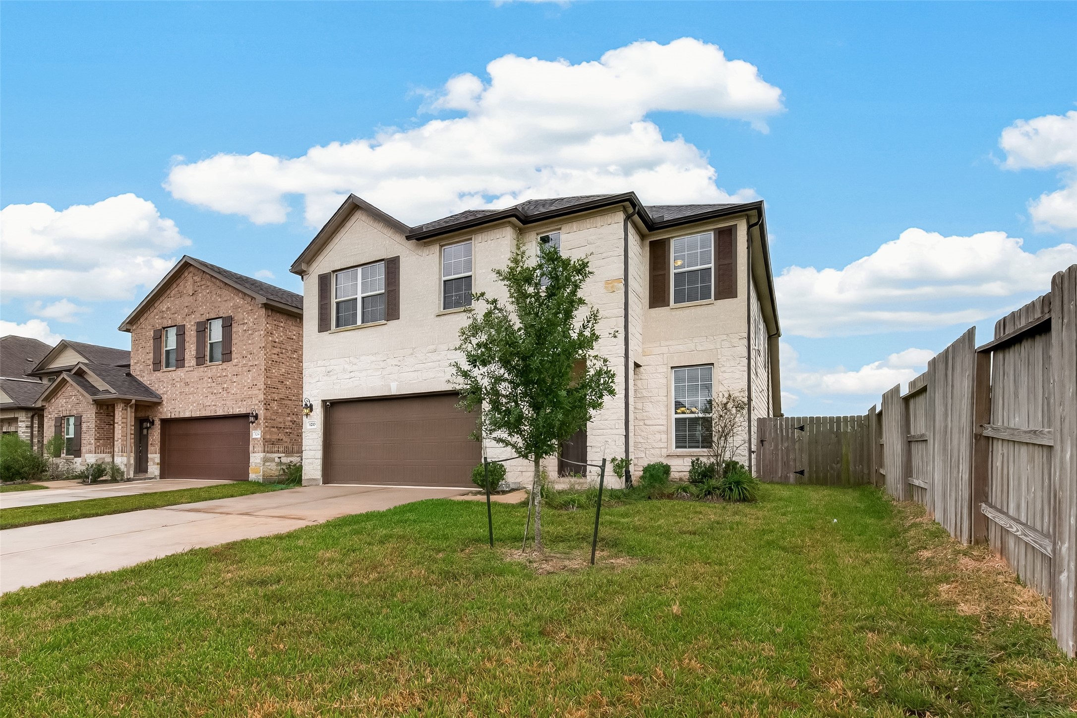 The home features an abundance of windows that allow natural light to flow throughout, creating a bright, warm, and inviting atmosphere.