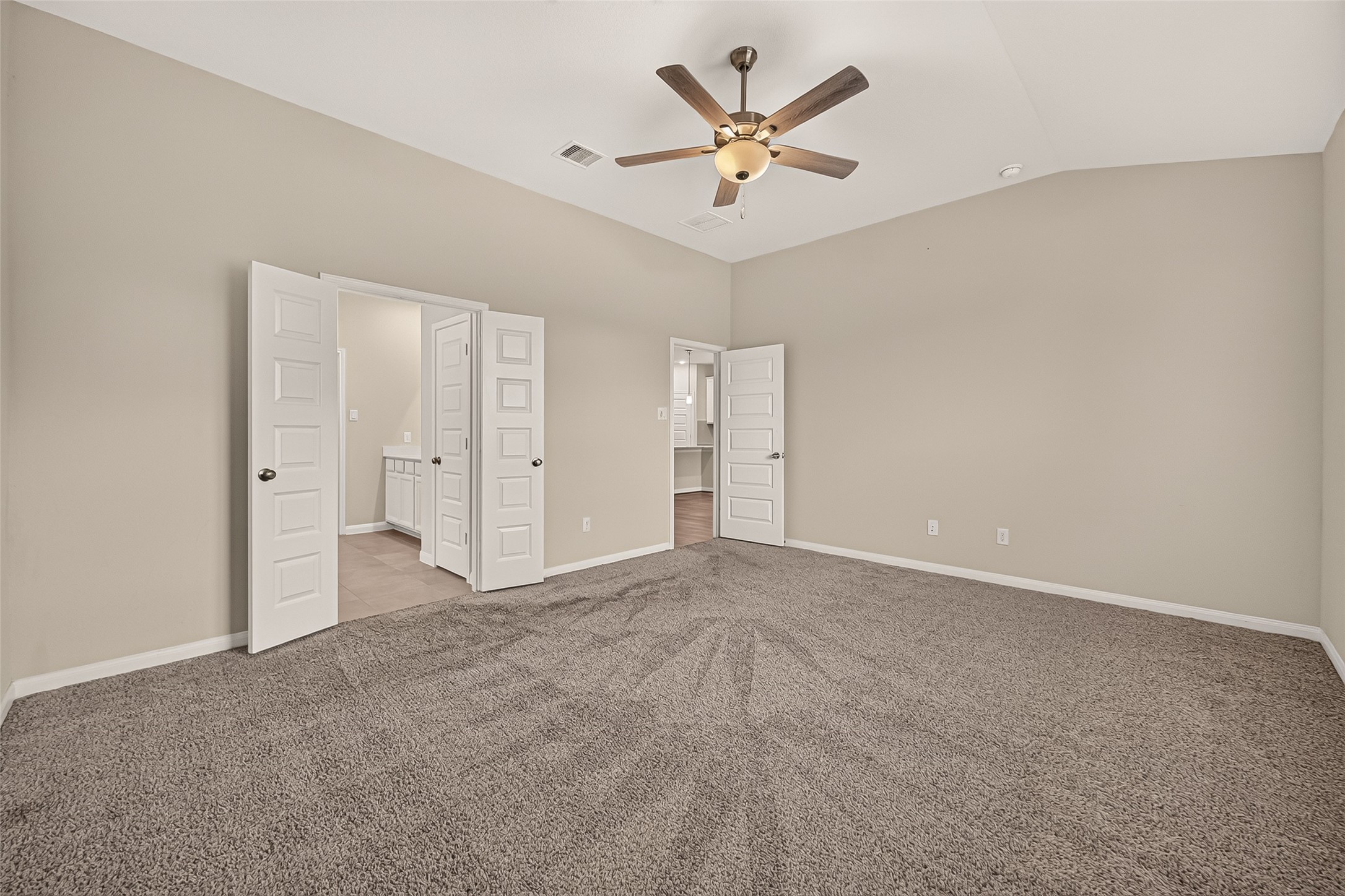 Discover the expansive owner's retreat, featuring ample space and elegant finishes for ultimate relaxation.