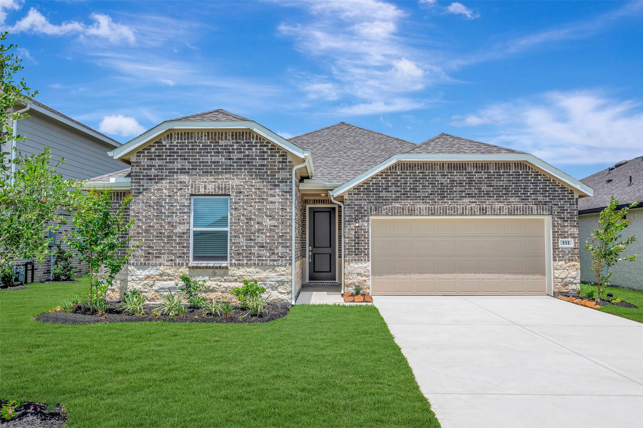Charming Passionflower II design by K. Hovnanian Homes in elevation TA built in Aspire at The Hills of Town Creek.