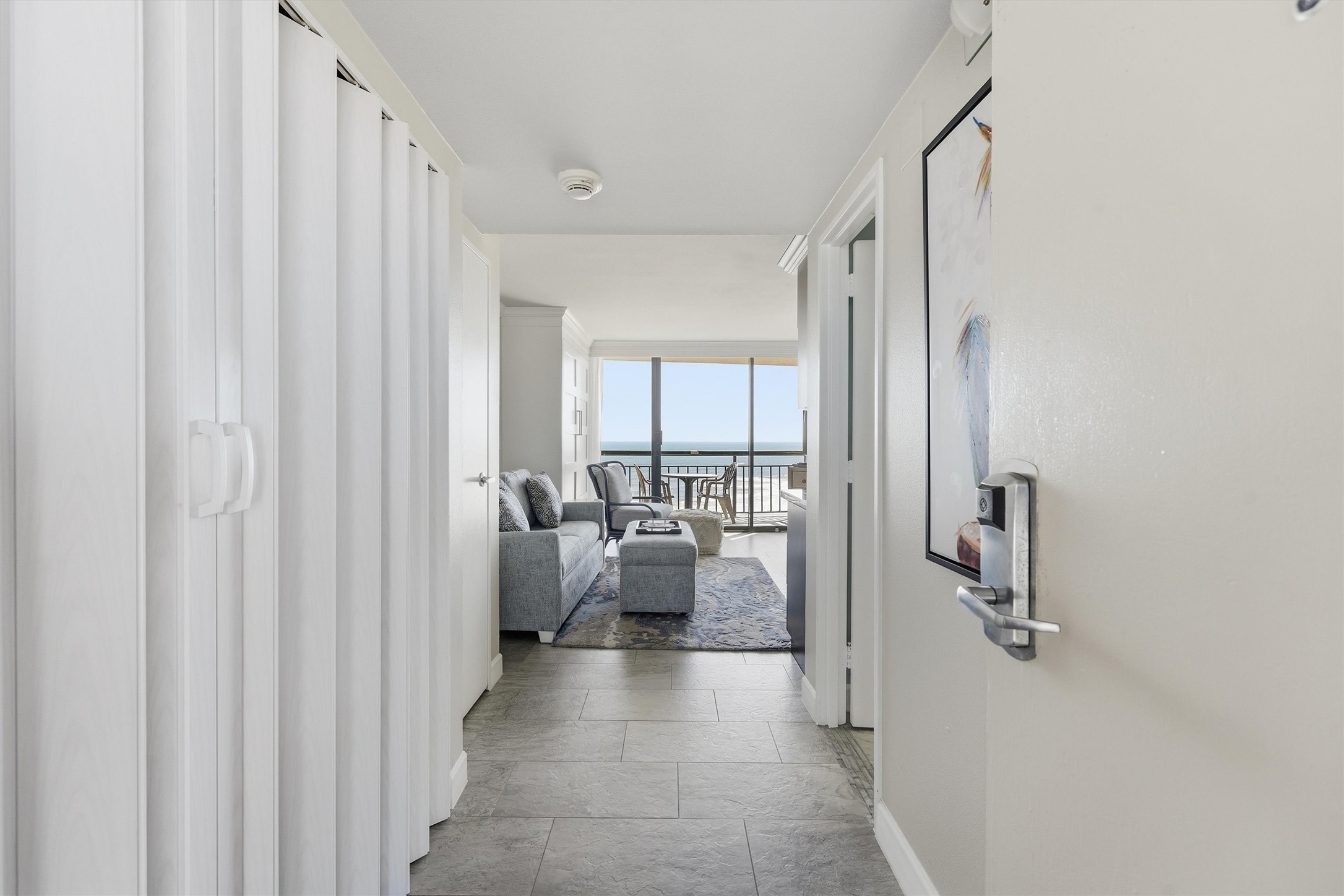 A welcoming entry leads to a bright living space with beautiful Gulf views straight ahead.