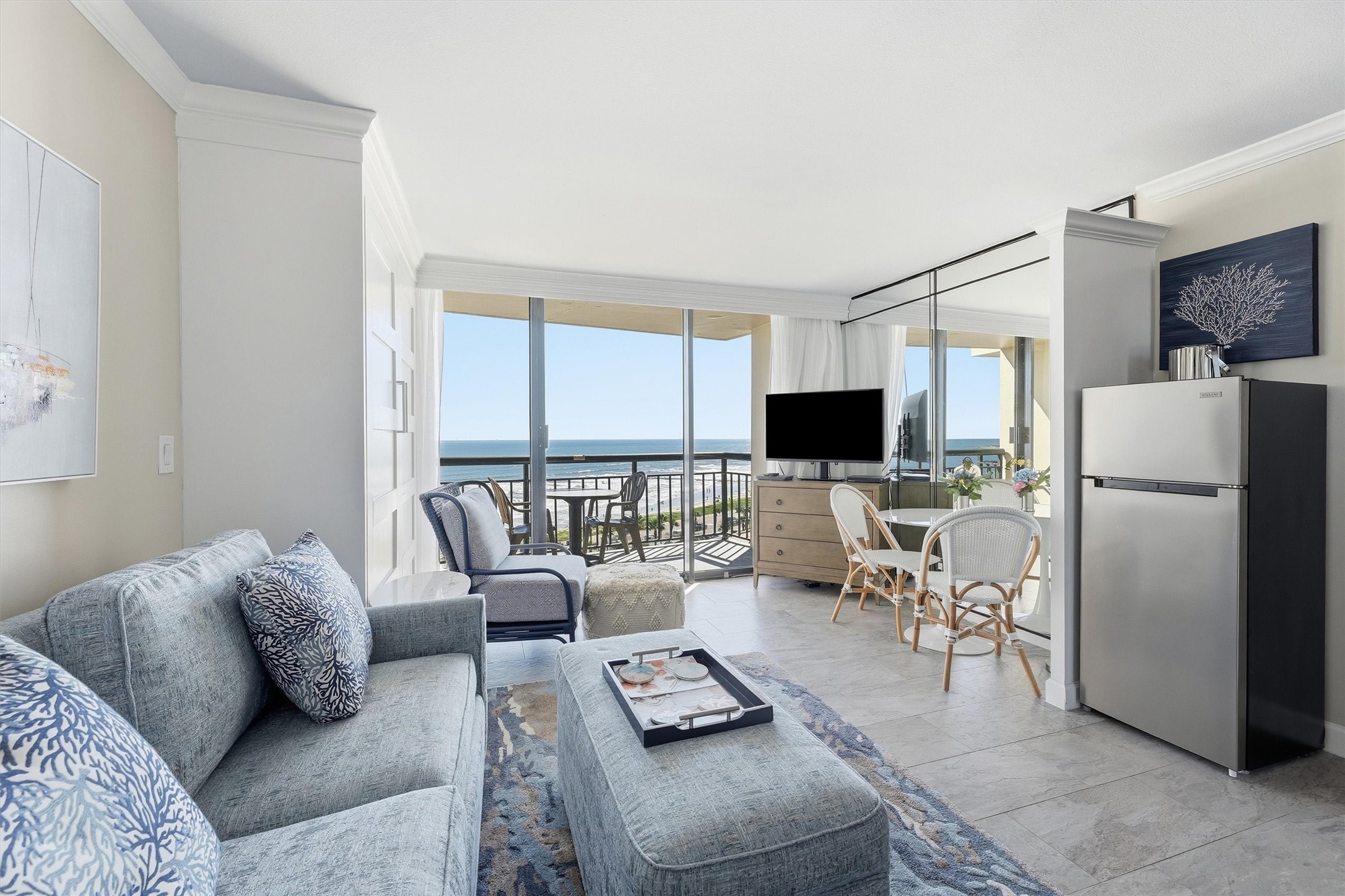 Enjoy an open living and dining area filled with natural light and views of the water.