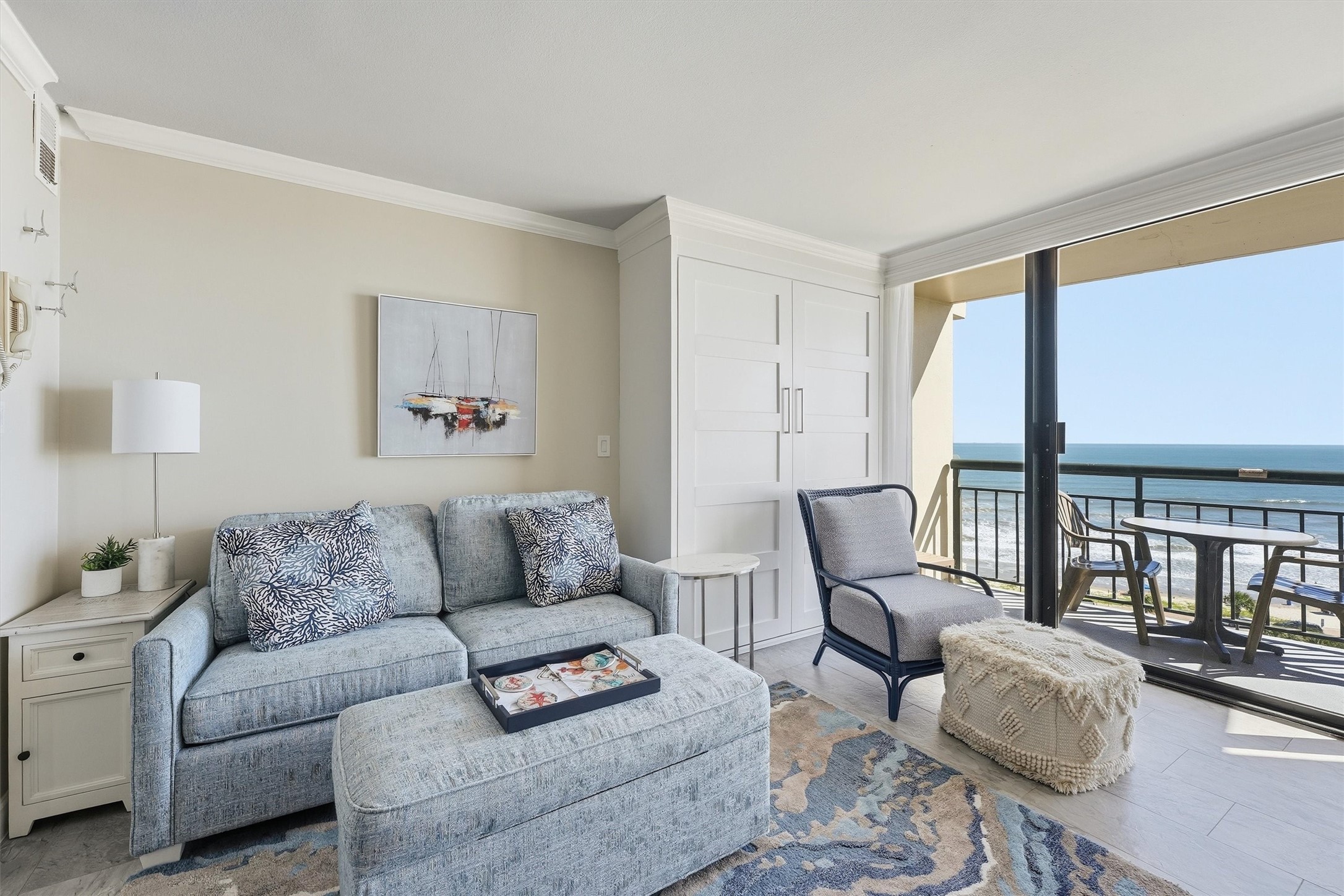 Relax in the inviting living area while taking in the Gulf through expansive sliding glass doors.