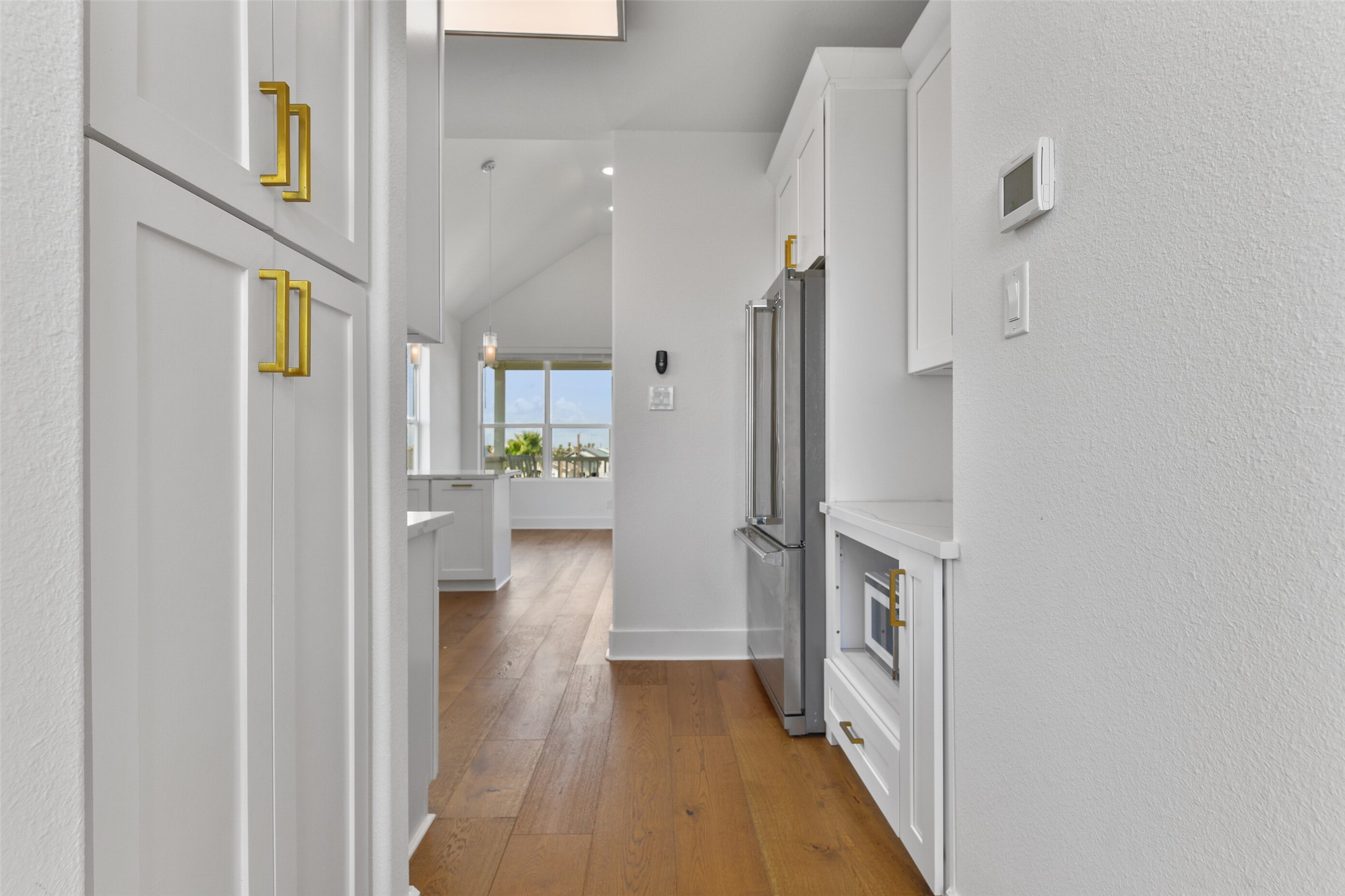 Additional storage is located in the hallway off the kitchen.