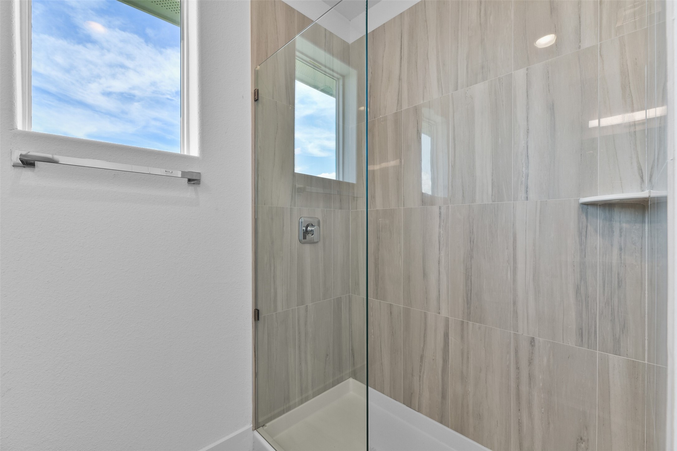 Bathroom three is complete with a large walk-in shower.