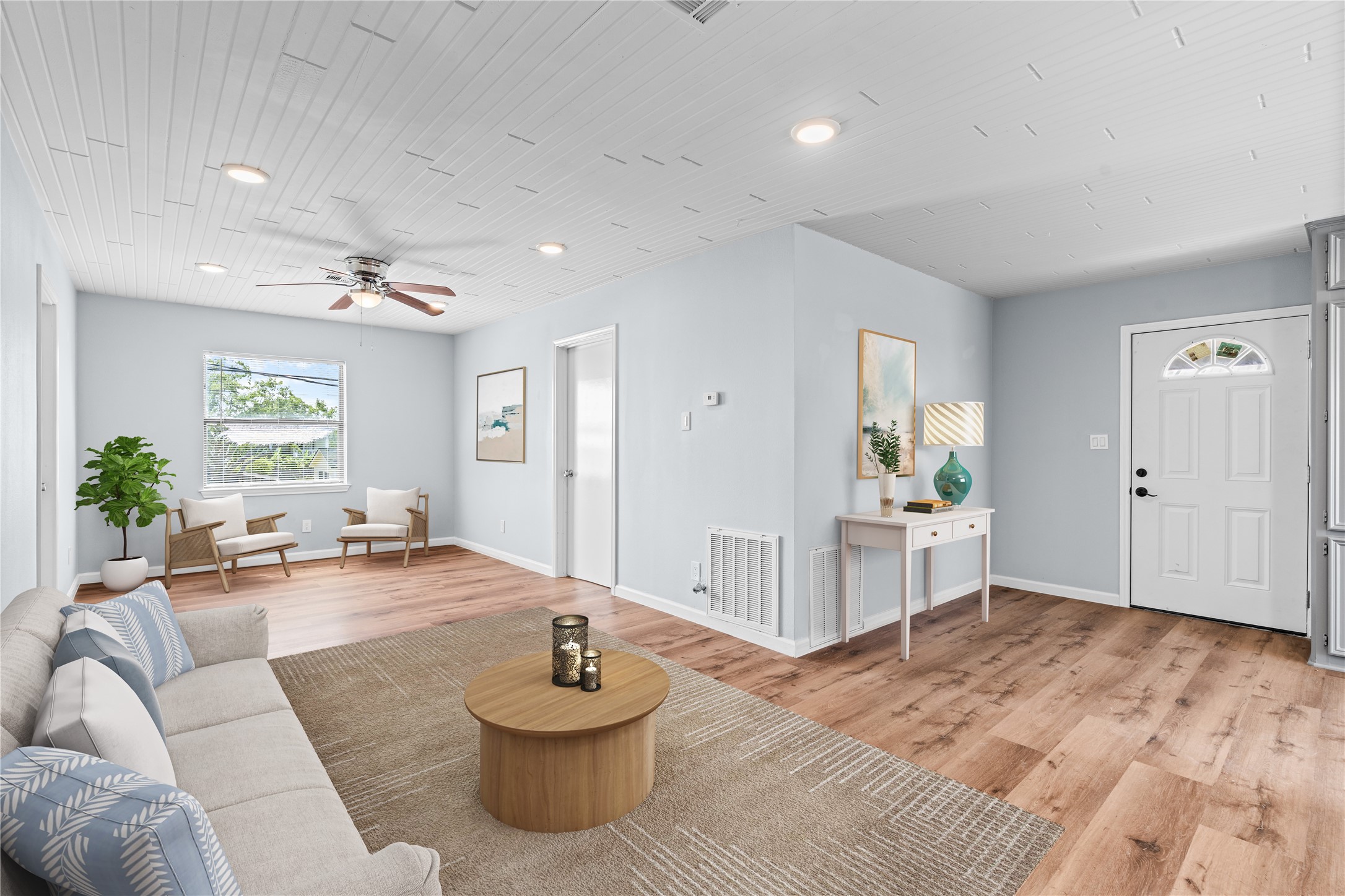 Designed with flexibility in mind, the expansive living area offers room to spread out while maintaining a bright, welcoming atmosphere.