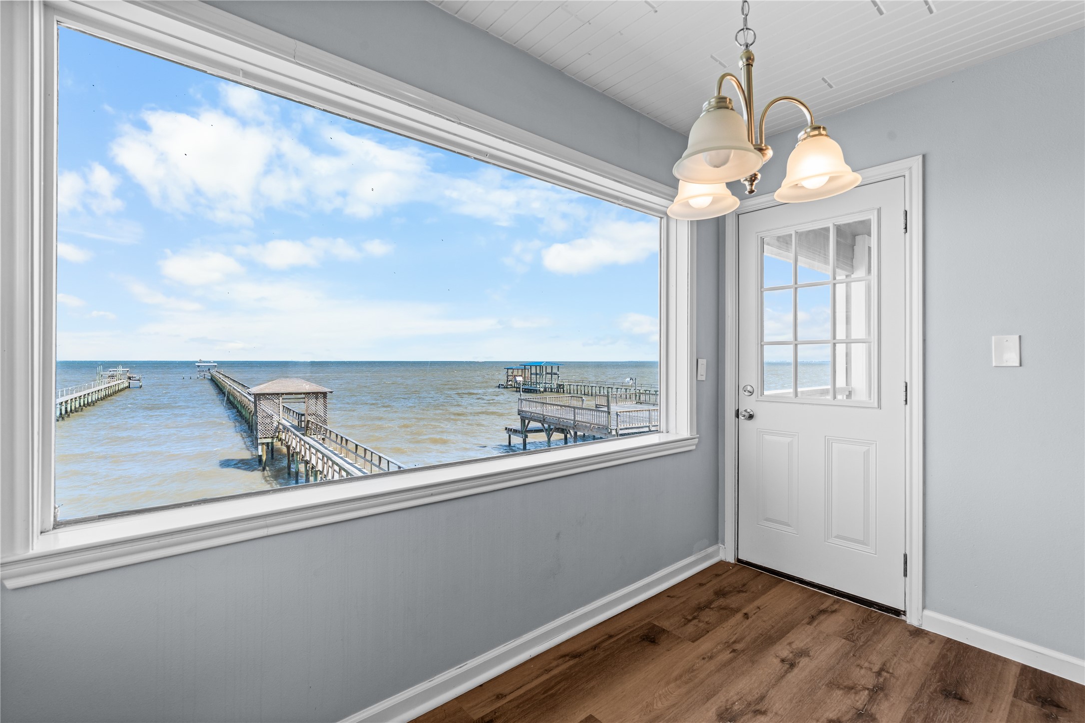 Positioned to capture uninterrupted bay views, the dining area transforms every meal into a waterfront experience.