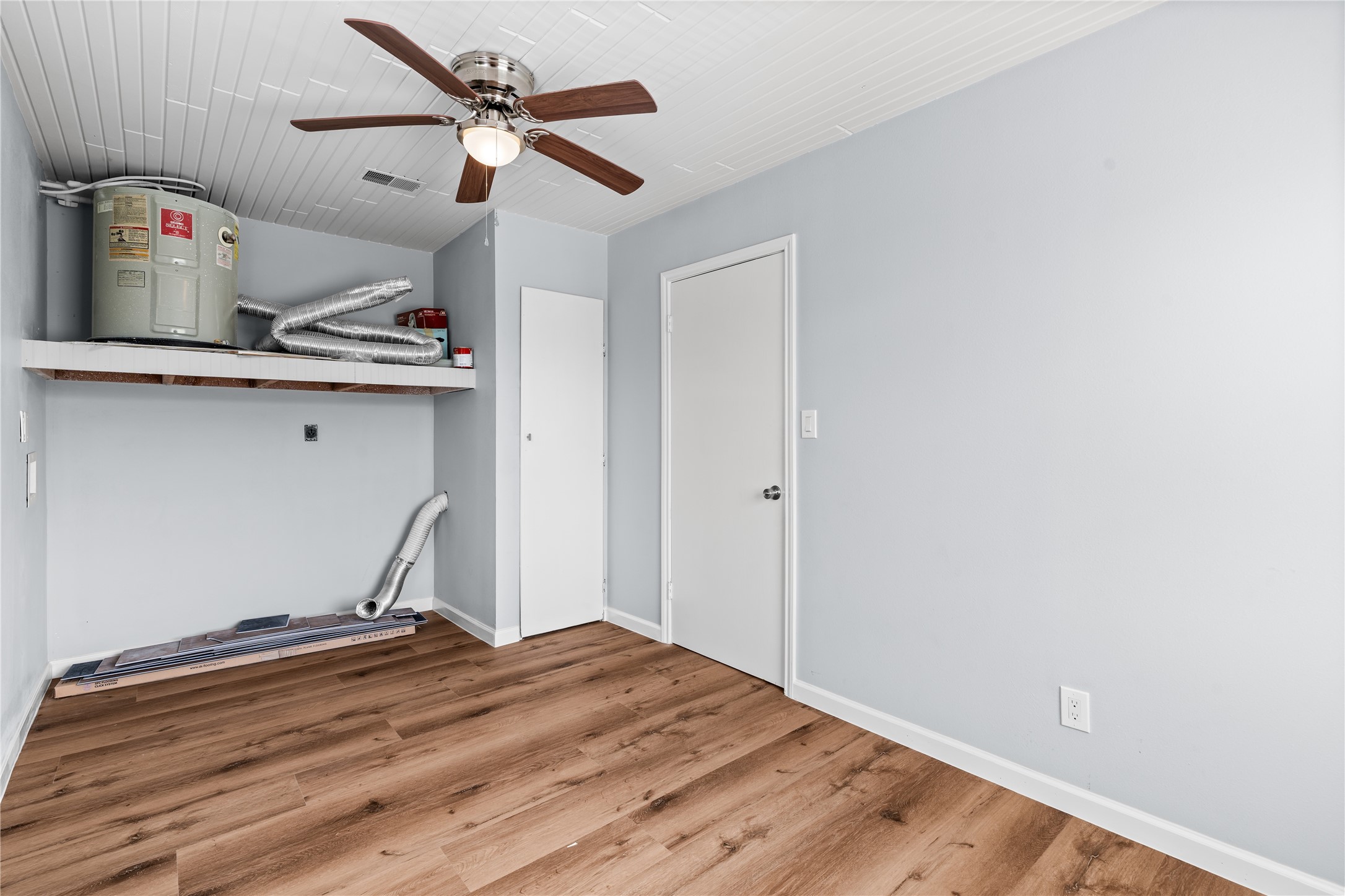 A versatile laundry room with space for storage, a workshop, hobby area, or home gym, offering flexibility to fit your lifestyle.