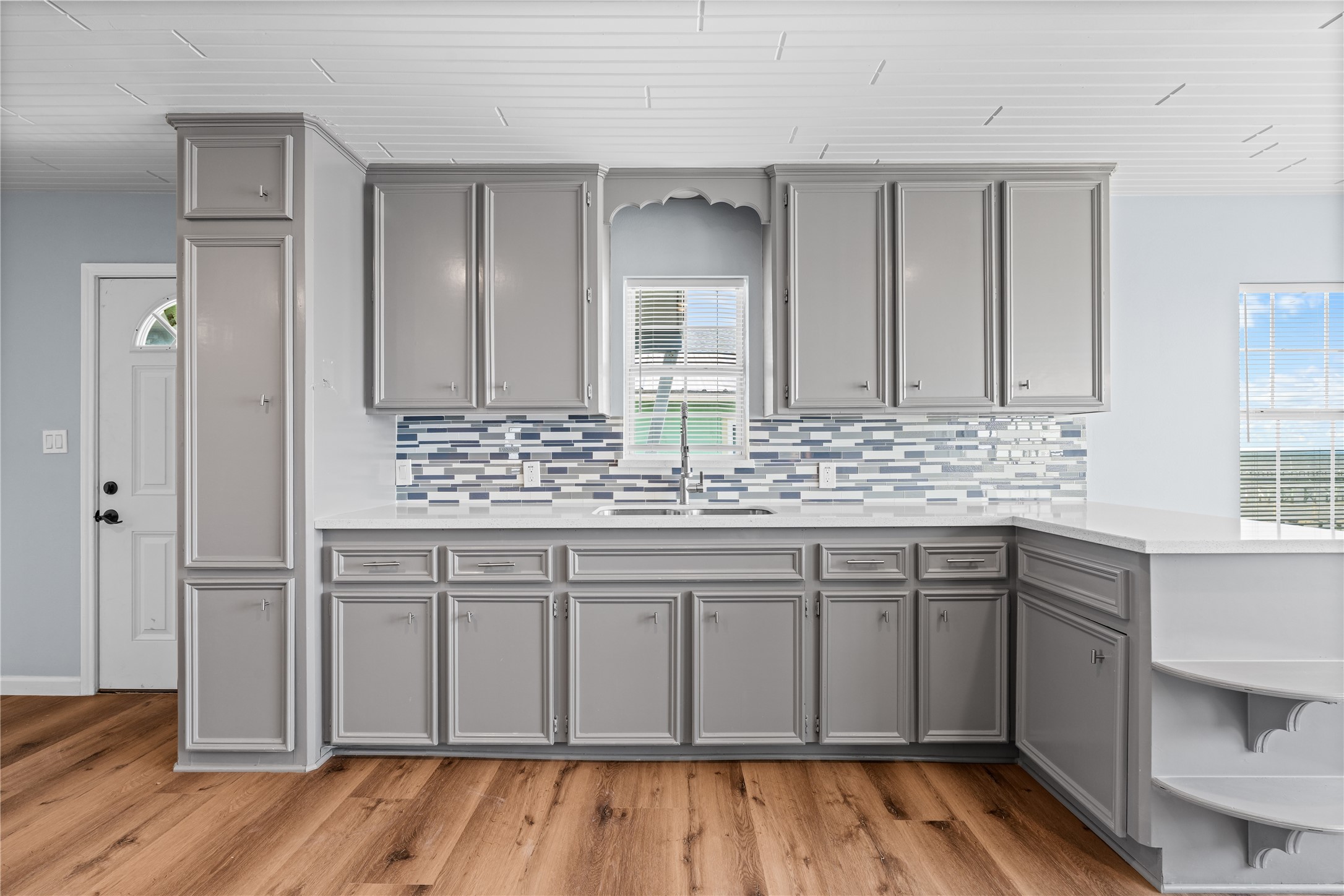 With its open footprint and understated coastal finishes, the main living area provides a relaxed setting that feels equally suited for entertaining or everyday life.