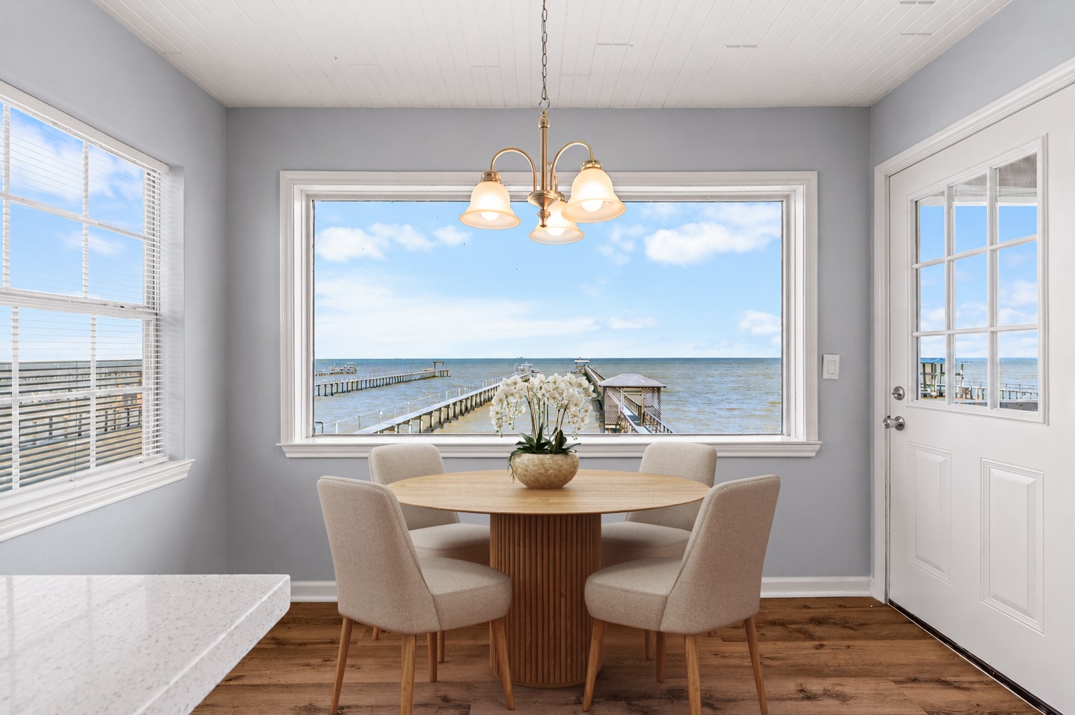 A thoughtfully designed kitchen anchors the main living area, offering generous storage, expansive countertops, and an open, inviting layout.