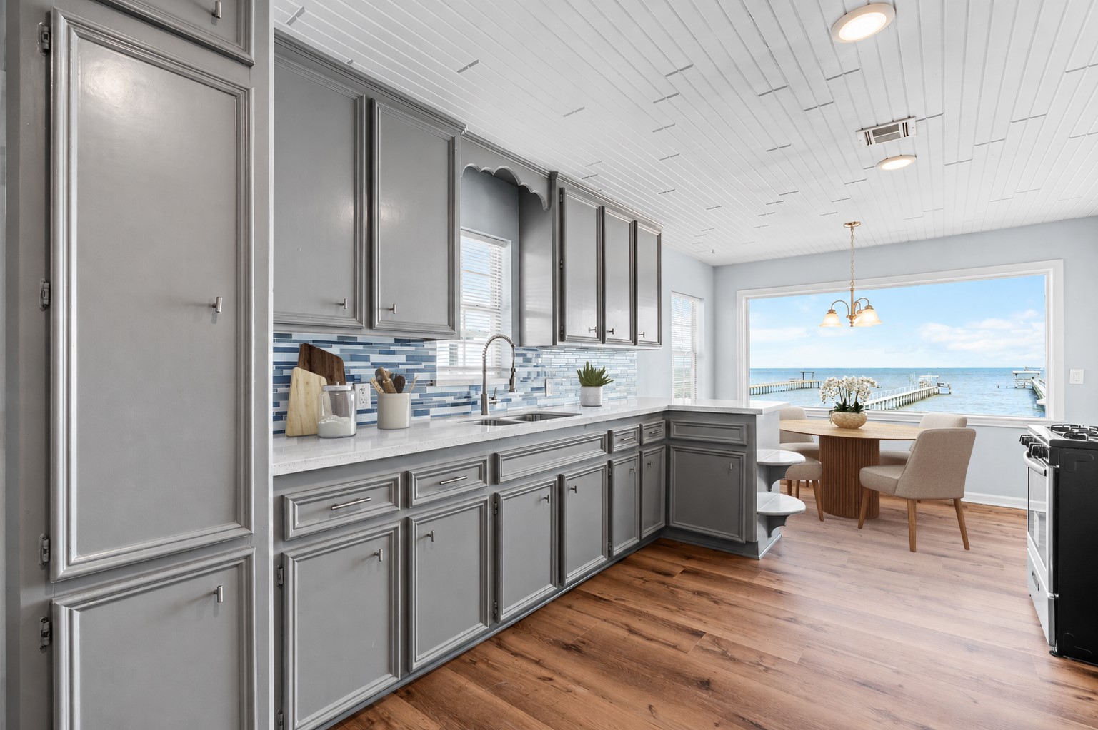 Positioned to capture sweeping waterfront vistas, this light-filled dining area invites you to slow down and savor the scenery.