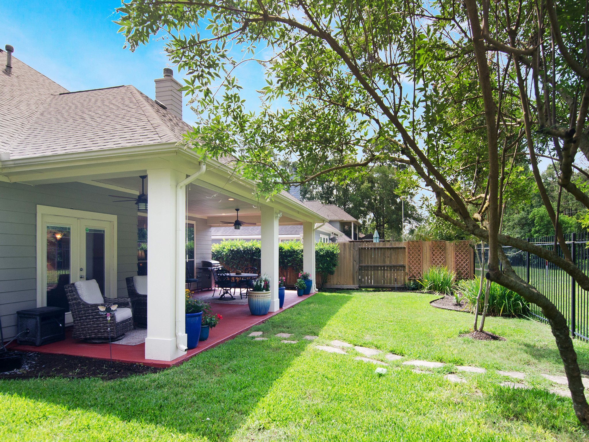 Enjoy a beautifully kept backyard with room for recreation and relaxation.