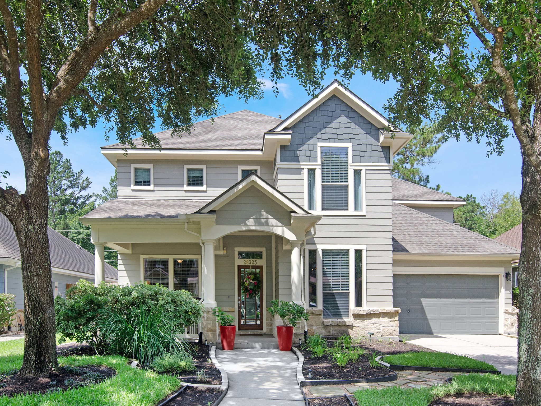 This beautiful, well maintained family home welcomes you with exceptional curb appeal, highlighted by a charming covered front porch, attractive stone accents, mature landscaping and recent exterior improvements including, paint and new roof. The oversized two-car garage provides generous space for storage, hobbies and everyday convenience.
