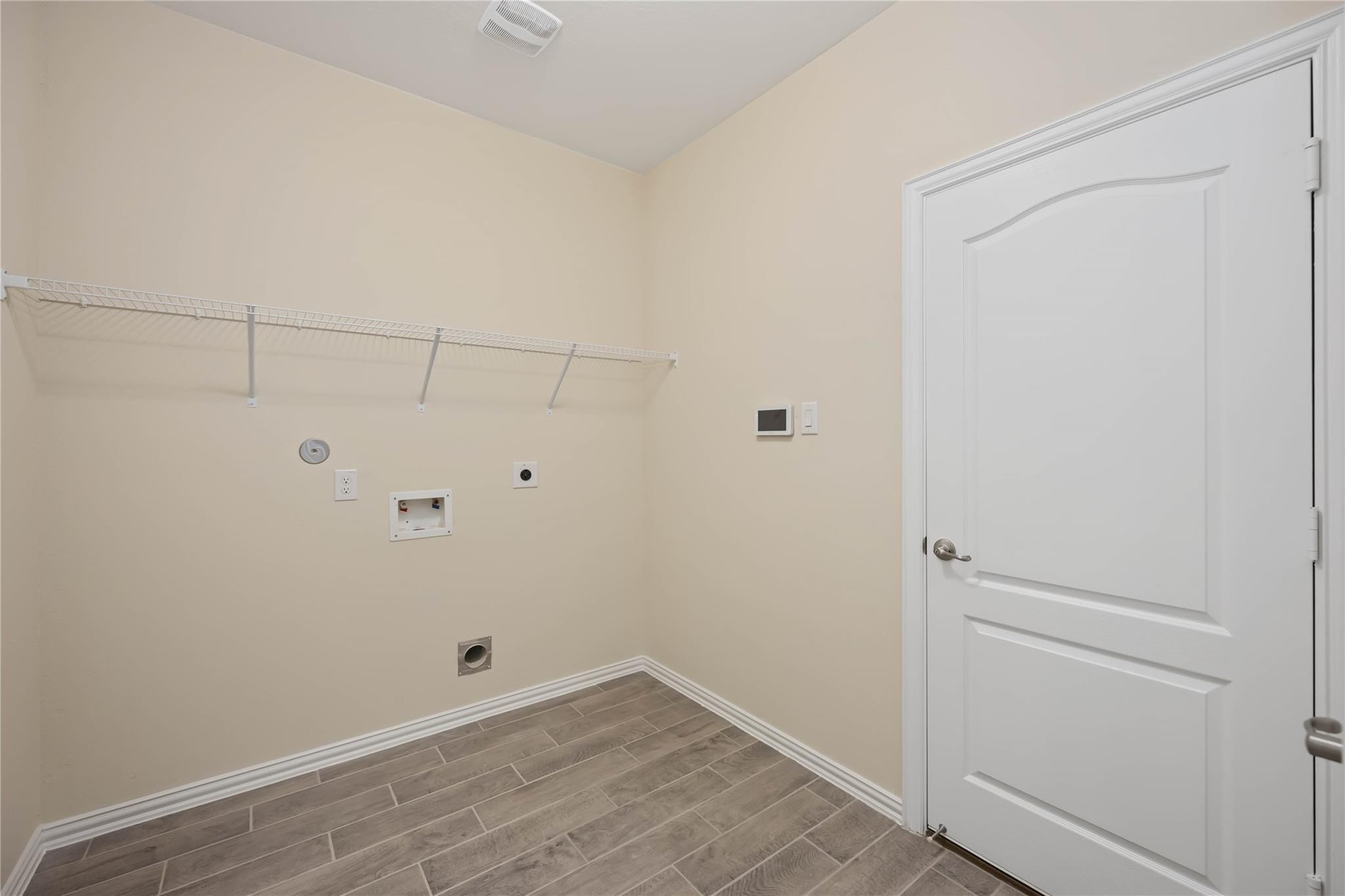 1st floor laundry room, with storage closet