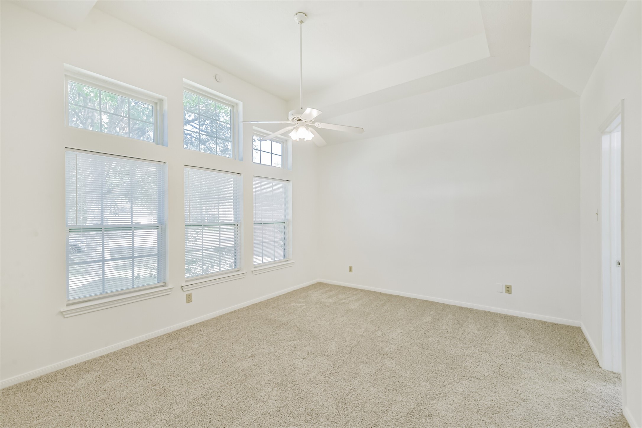 Primary Bedroom with High Windows Allowing Natural Light