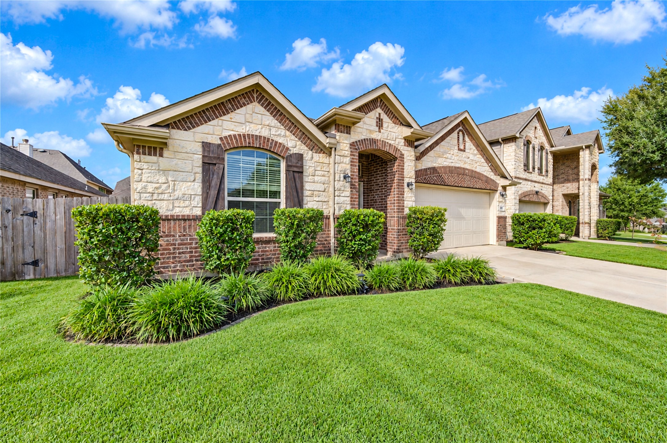 Stone, brick and shuttered windows give the faade a classic, well-balanced presence from the street.