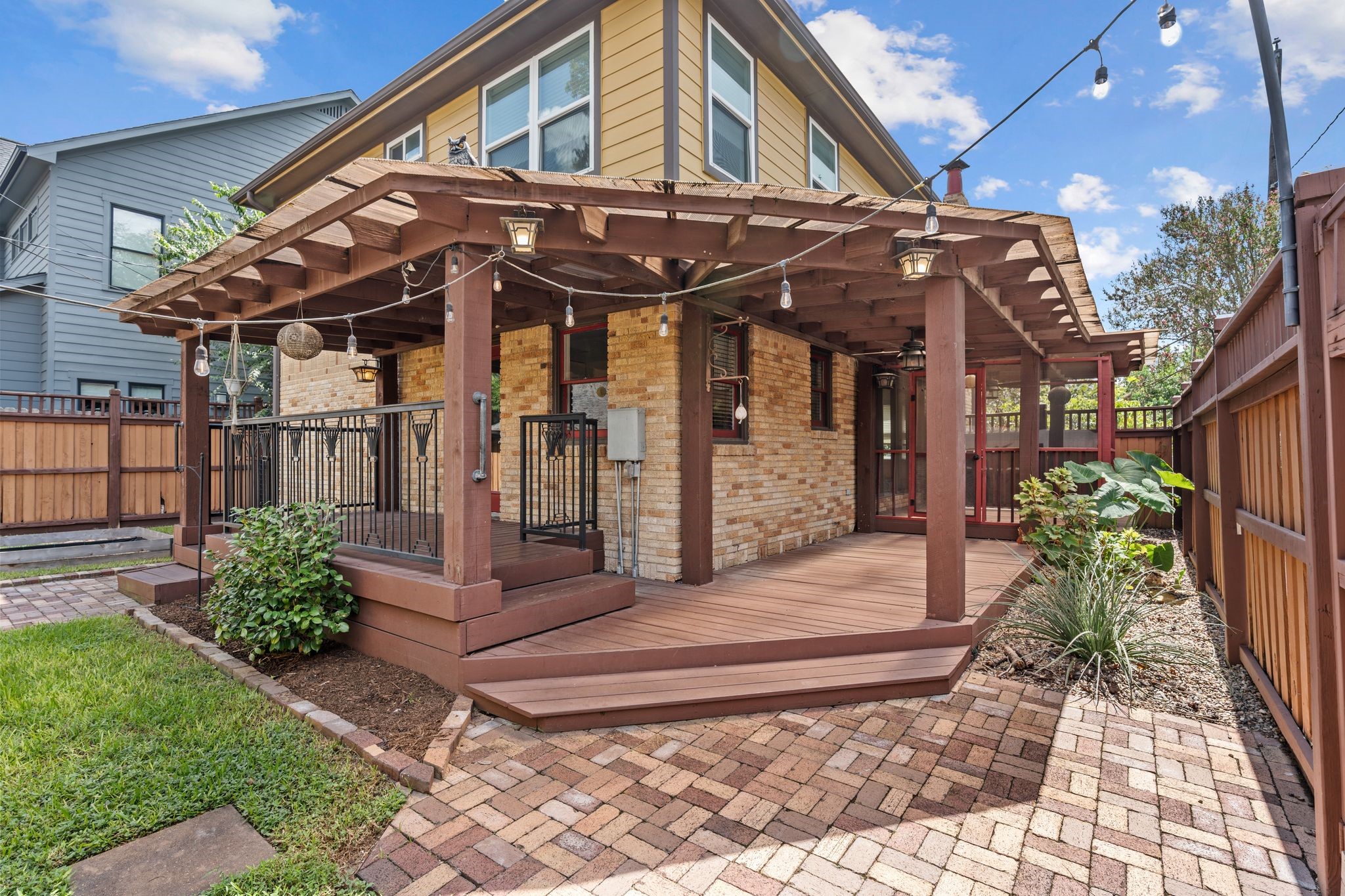 The back yard deck wraps around and has access from the kitchen and living room.