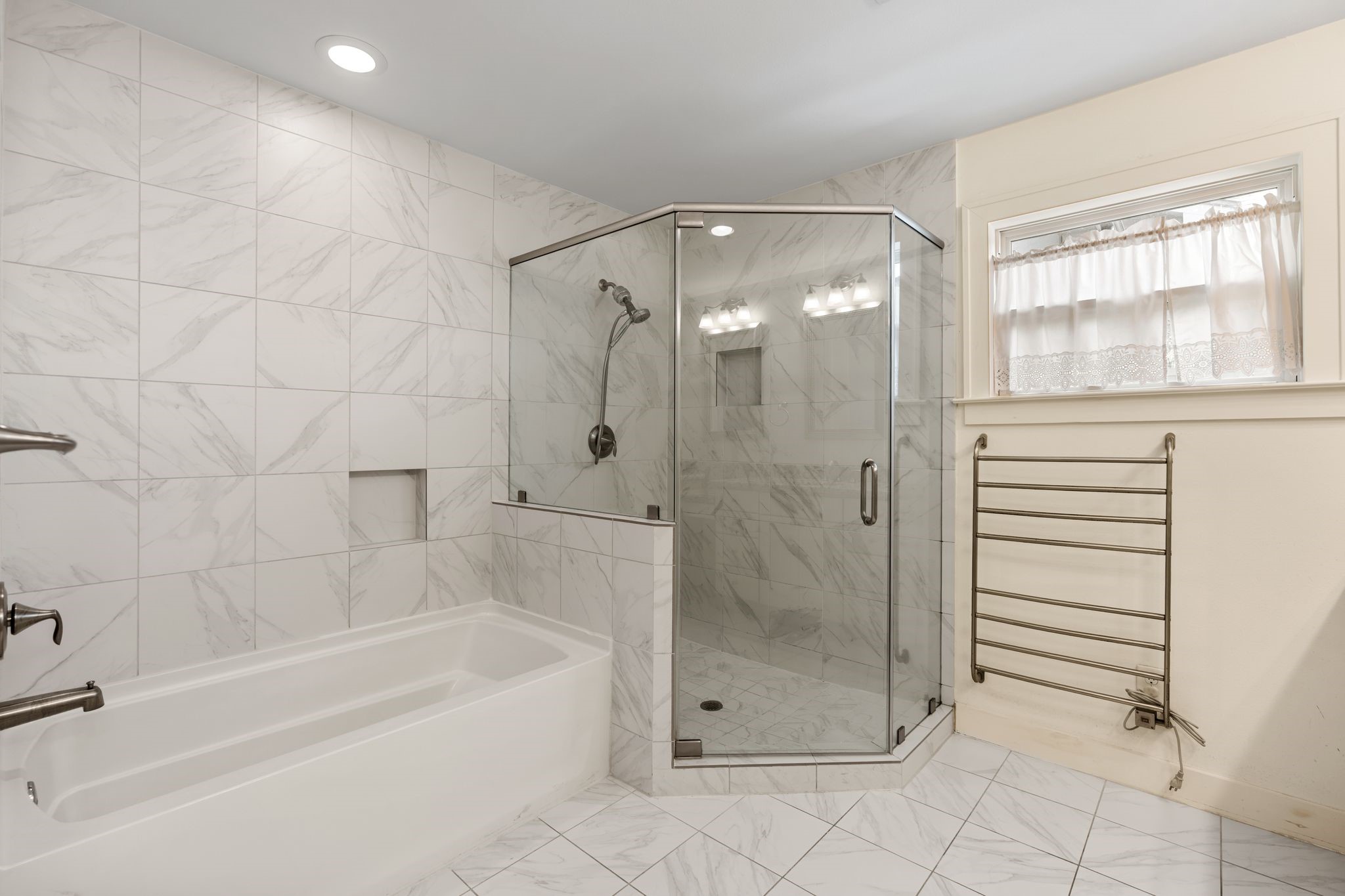 The primary bath features a large shower with separte tub.