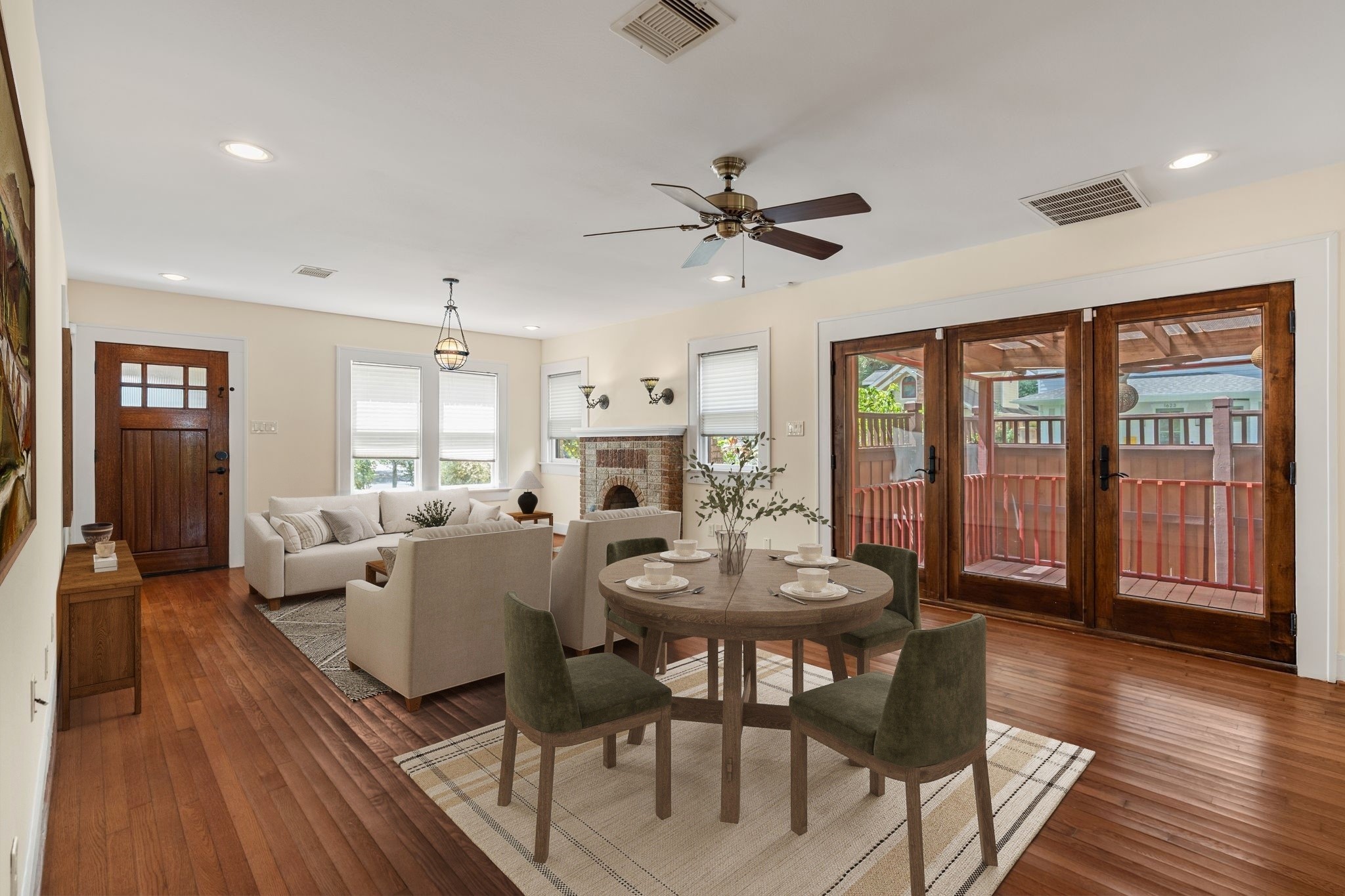 The dining space has easy access to the wrap around deck. Virtually staged. The dining space has easy access to the wrap around deck. Virtually staged.