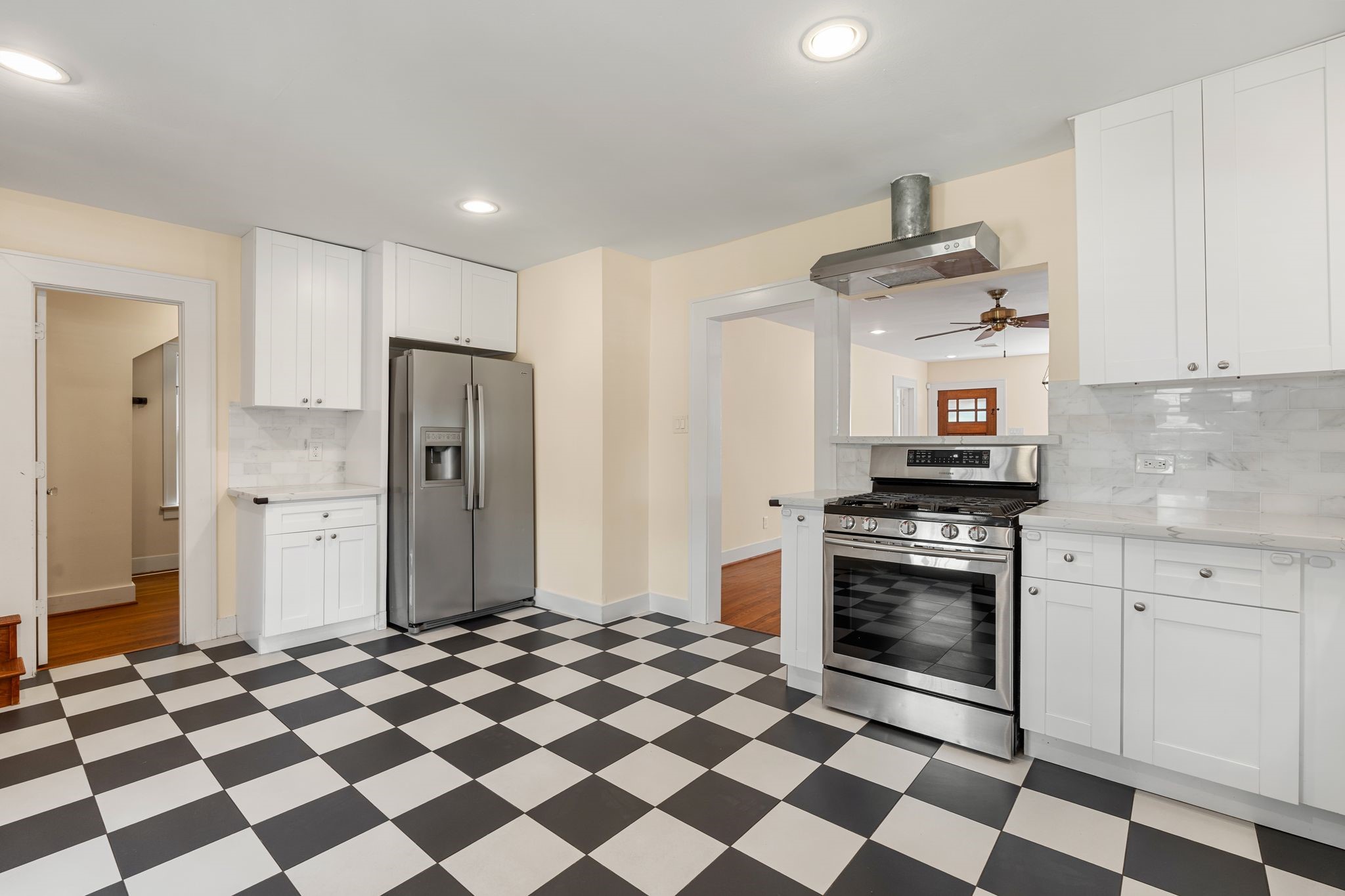 The spacious kitchen opens to the living and dining space which works well for entertaining and family living. The spacious kitchen opens to the living and dining space which works well for entertaining and family living.