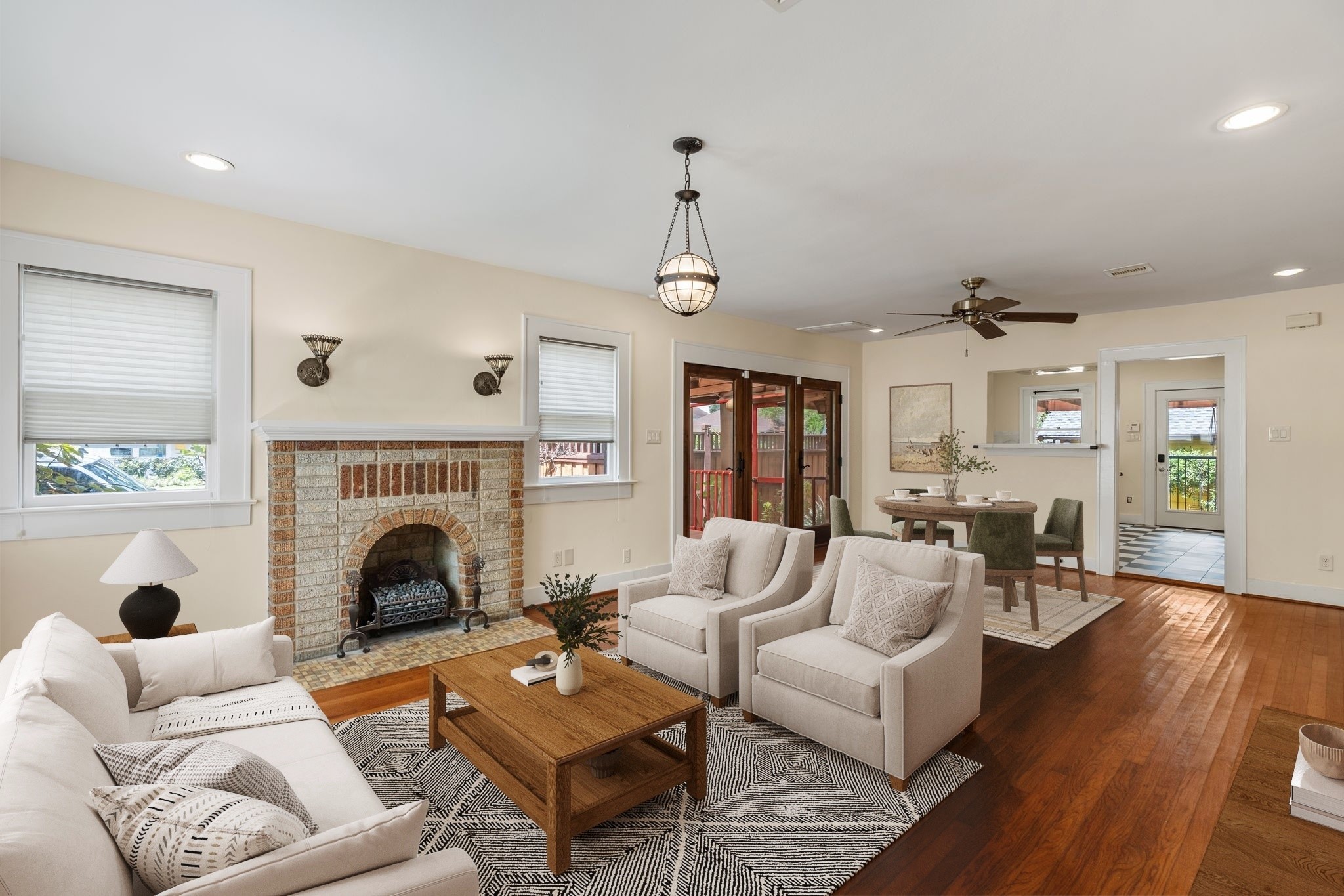 The living room flows seamlessly into the dining space and kitchen and is the perfect space to relax with your family or watch the big game. Virtually staged. The living room flows seamlessly into the dining space and kitchen and is the perfect space to relax with your family or watch the big game. Virtually staged.