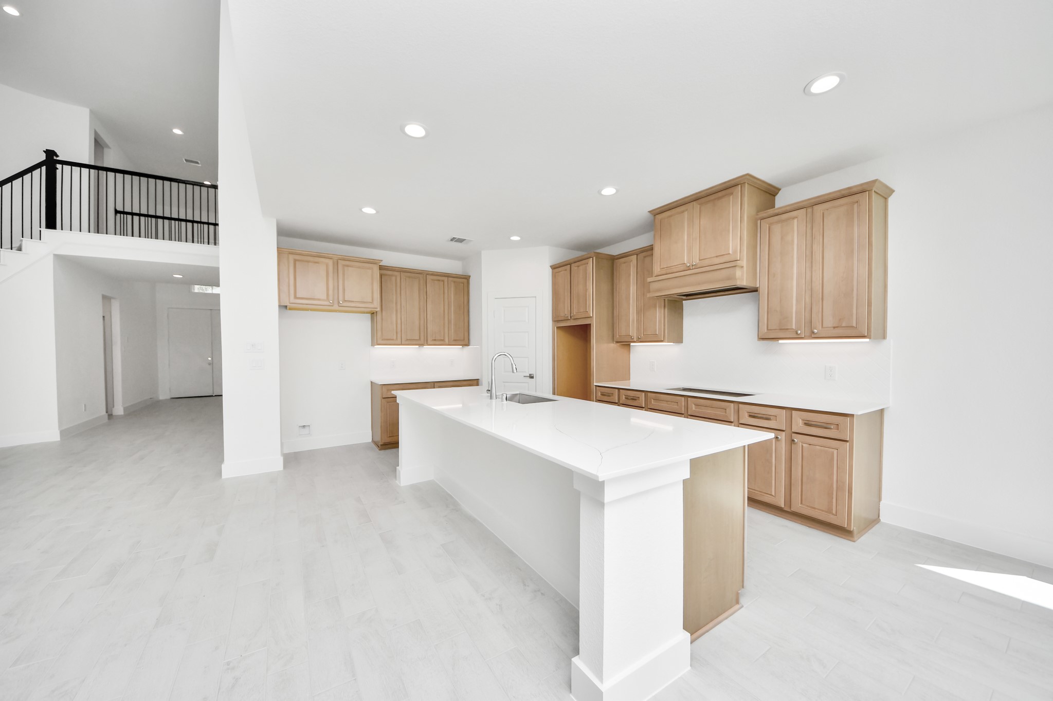 The extended counter area adds both practicality and style, making meal preparation a breeze. Every detail is thoughtfully designed to enhance the kitchen's functionality and aesthetic appeal. Sample photo of completed home with similar floor plan. Actual colors and selections may vary.