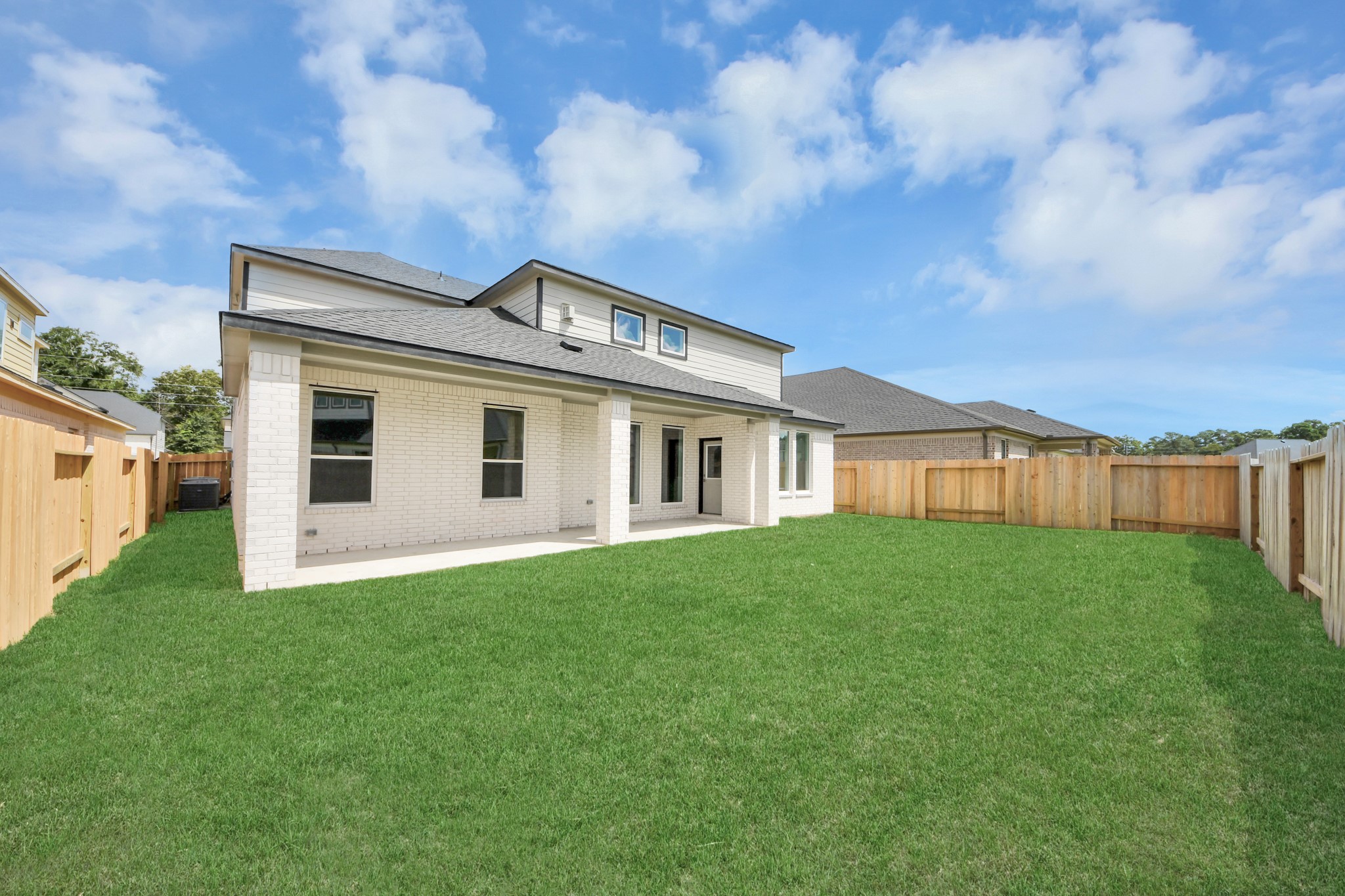 Backyard retreat, offering an abundance of space for kids to play and explore. The possibilities are endless in this outdoor haven, where the joy of open-air activities and family gatherings awaits. Sample photo of completed home with similar floor plan. Actual colors and selections may vary.