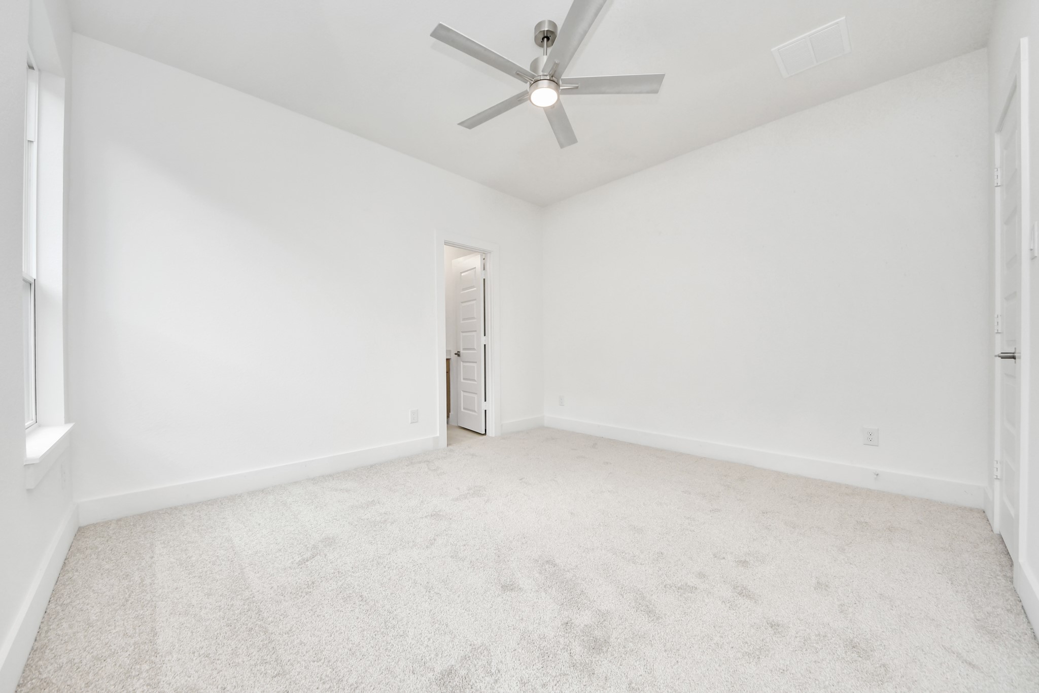 Generously sized secondary bedrooms featuring spacious closets, soft and inviting carpeting underfoot, large windows allowing plenty of natural light, and the added touch of privacy blinds for your personal retreat. Sample photo of completed home with similar floor plan. Actual colors and selections may vary.